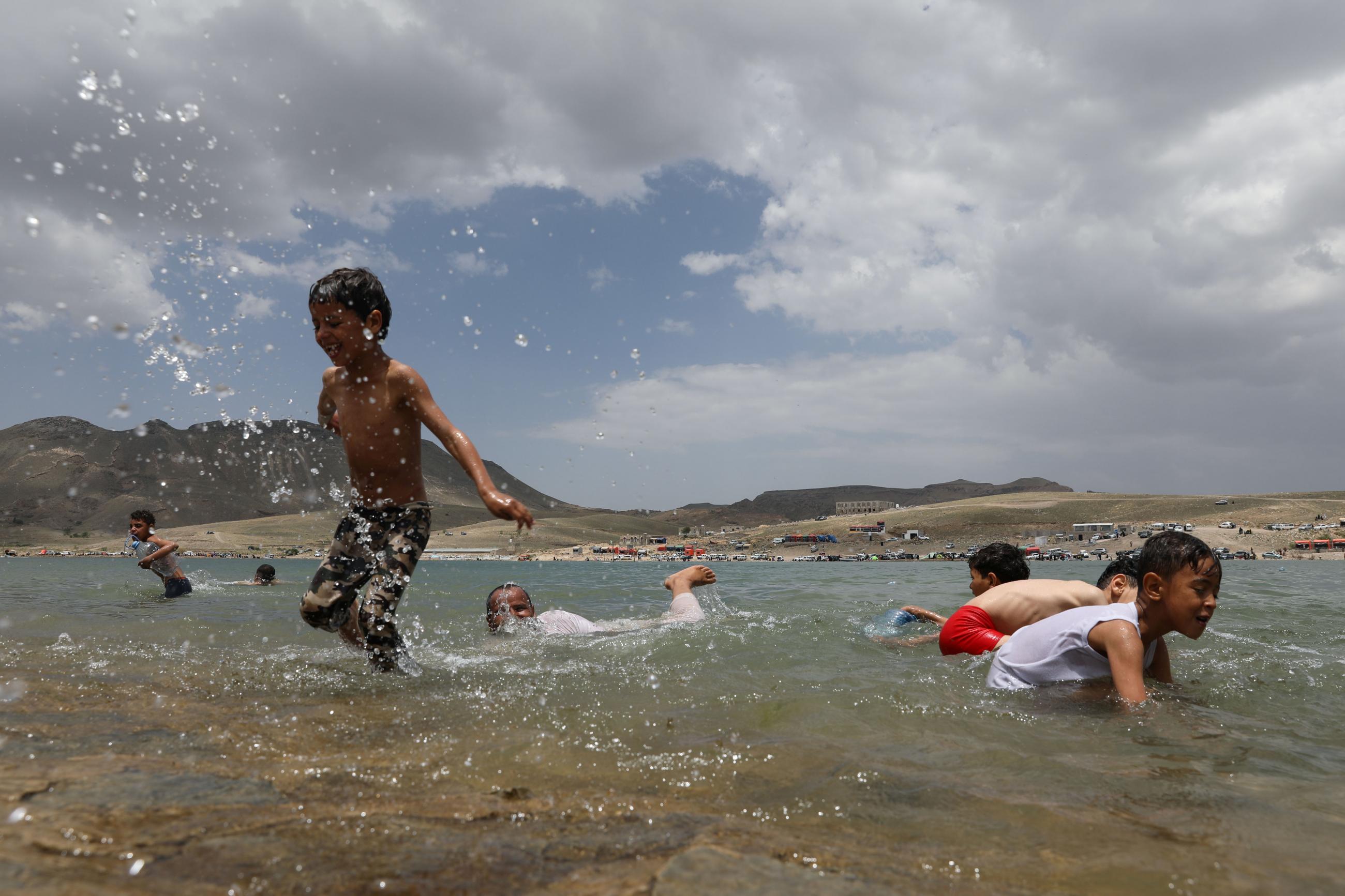 Children swim during an excursion at a dam in Sayyan near Sanaa, Yemen on. May 16, 2021. REUTERS/Khaled Abdullah