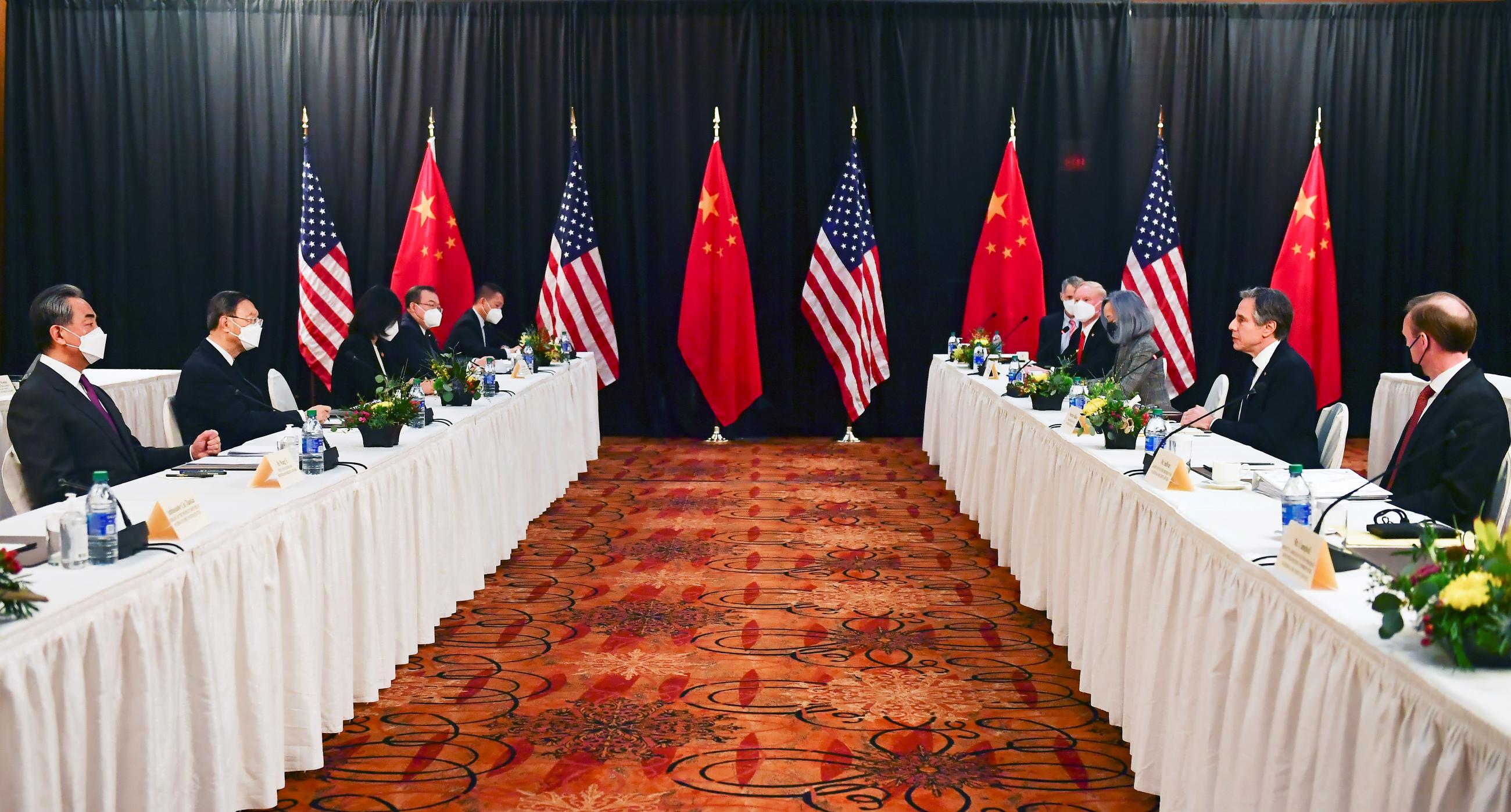 U.S. Secretary of State Antony Blinken, joined by National Security Advisor Jake Sullivan, speaks while facing Yang Jiechi, director of the Central Foreign Affairs Commission Office, and Wang Yi, China's State Councilor and Foreign Minister, at the opening session of U.S.-China talks at the Captain Cook Hotel in Anchorage, Alaska, U.S. March 18, 2021