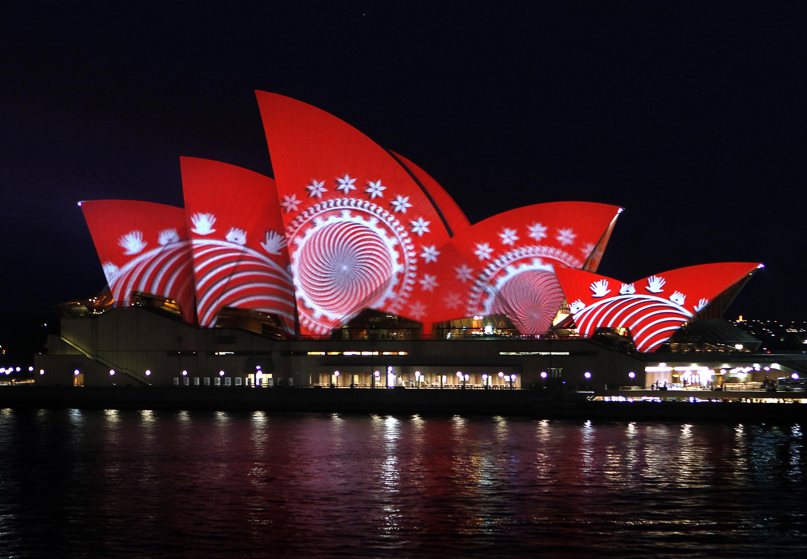 The sails of the Sydney Opera House turn red during a World Aids Day reception in Sydney on December 1, 2011. REUTERS/Tim Wimborne