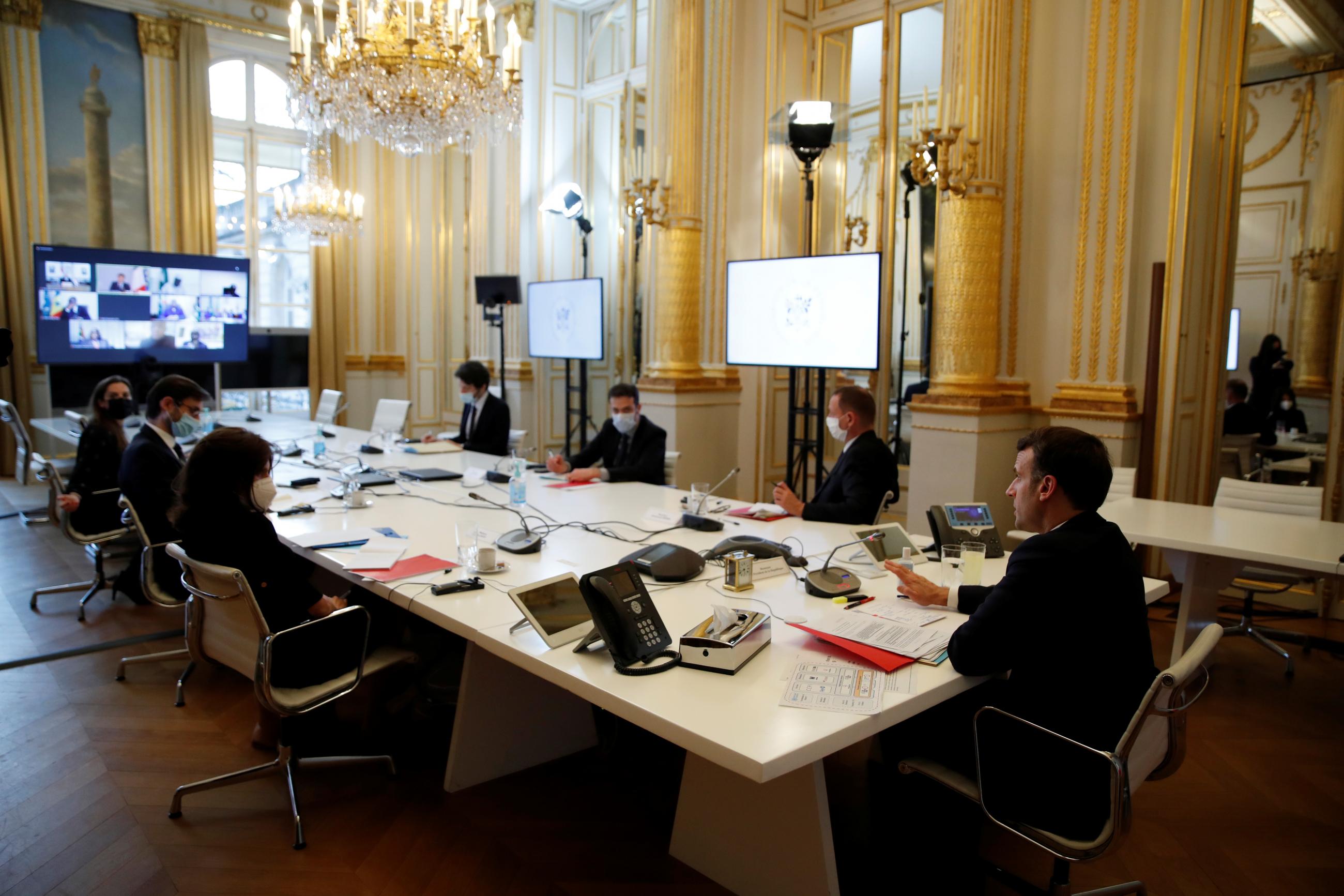 DOCUMENT DATE: February 17, 2021 French President Emmanuel Macron attends a video conference meeting with African Union officials following the ACT-A initiative to coordinate a global and united response to the coronavirus disease (COVID-19) pandemic, at the Elysee Palace in Paris, France, February 17, 2021