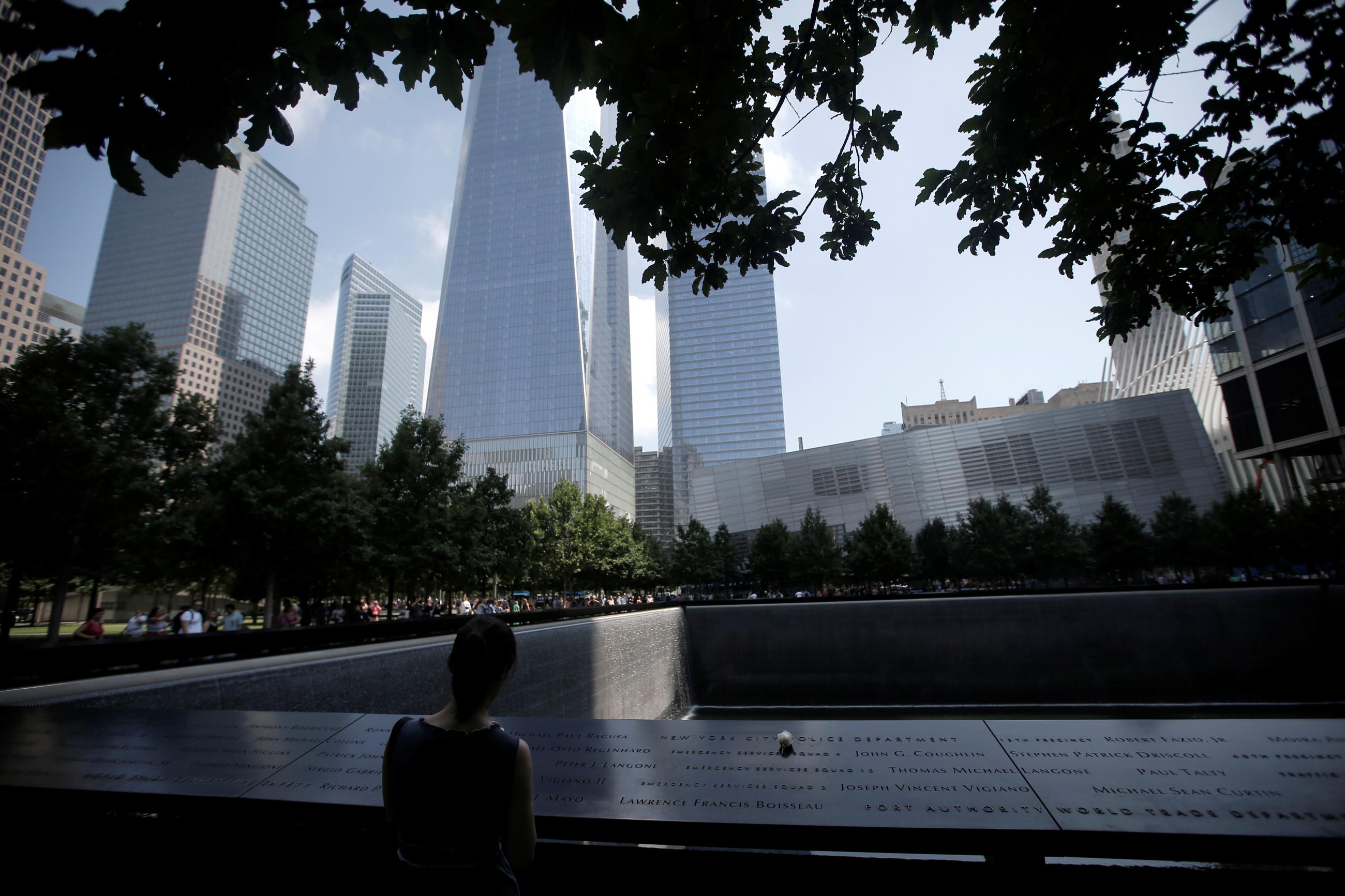 A single white rose is left at the edge of the South Pool of the 9/11 Memorial, in Manhattan, New York, on July 8, 2016.