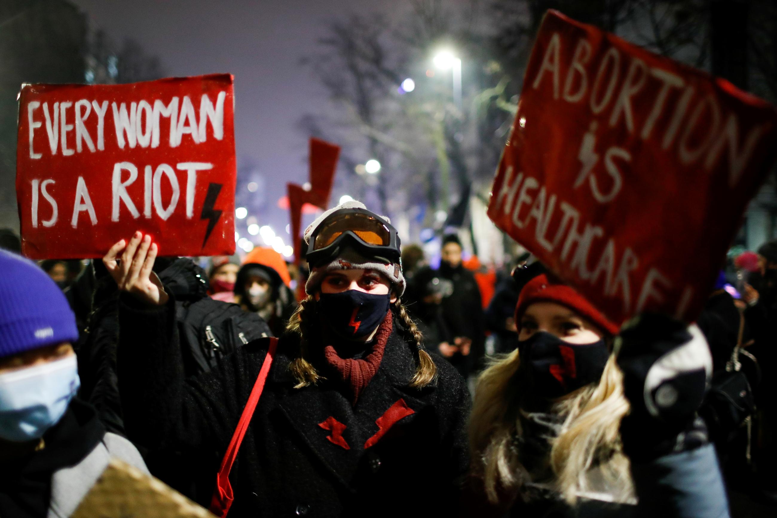 A demonstrator holds a placard during a protest against the verdict restricting abortion rights in Warsaw, Poland, January 28, 2021.