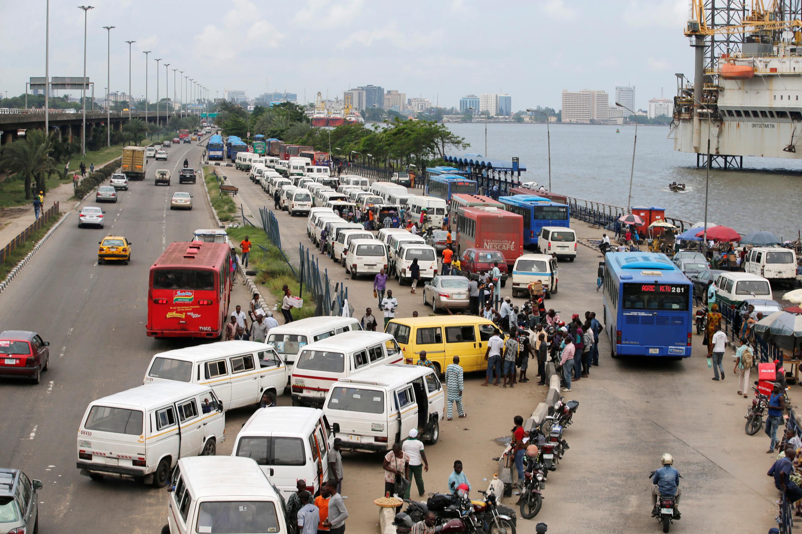 Commercial buses locally known as "Danfo" line the CMS bus-stop to pick up passengers along the Marina in Nigeria's commercial capital Lagos June 17, 2016.