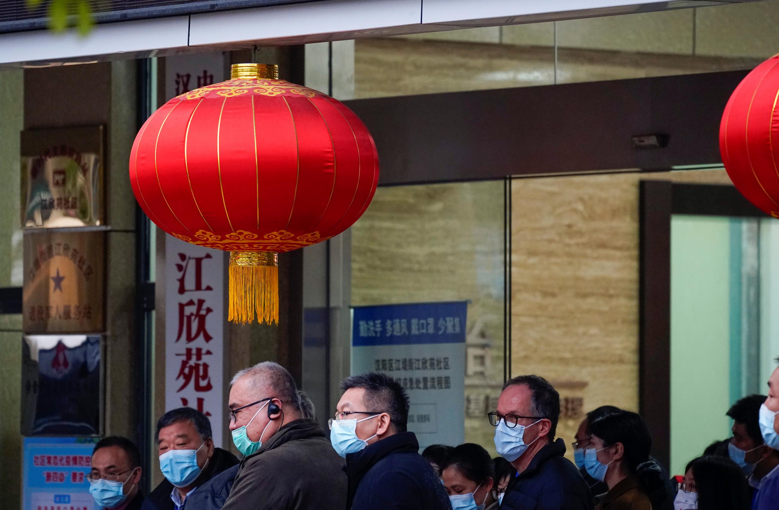 Members of the WHO team tasked with investigating the origins of COVID-19 leave the Jiang Xin Yuan Community Party People's Service Centre, in Wuhan, China, on February 4, 2021. REUTERS/Aly Song