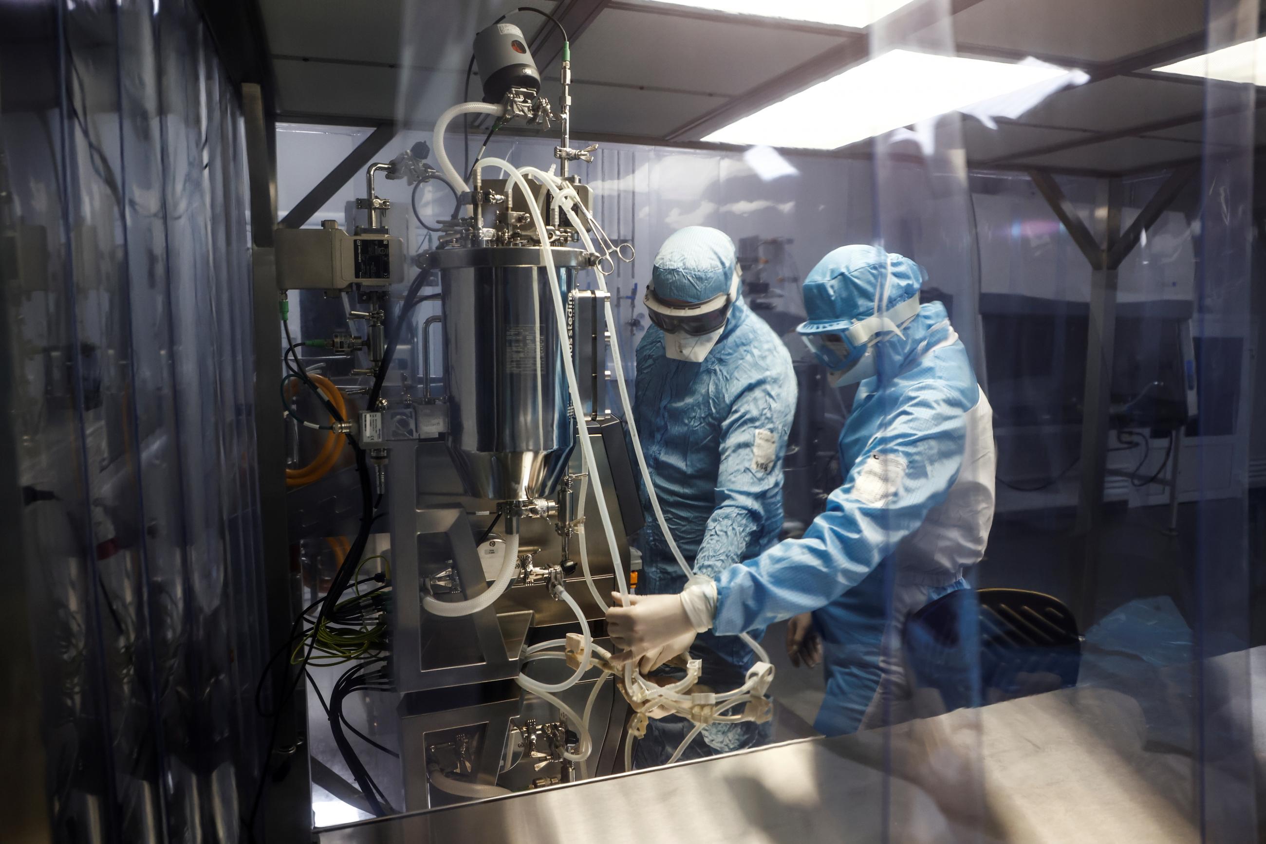 Specialists work with equipment at Chumakov Federal Scientific Center for Research and Development of Immune-and-Biological Products, which conducts development of Russia's third COVID vaccine.