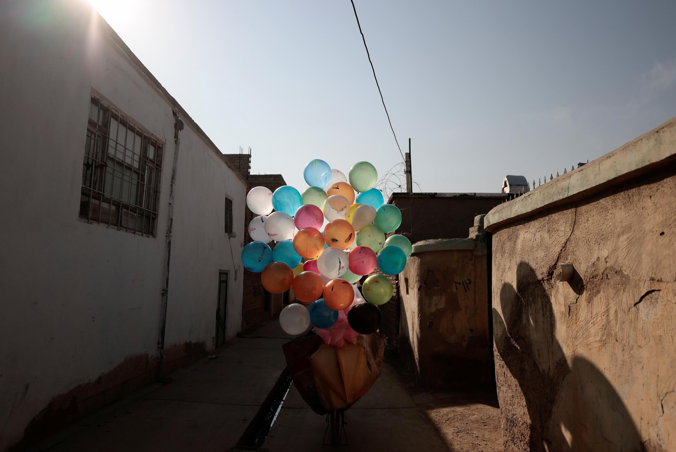 A balloon of many colours attached to a bicycle on a street in Khwaja Bughra in Kabul, Afghanistan, on November 7, 2021.