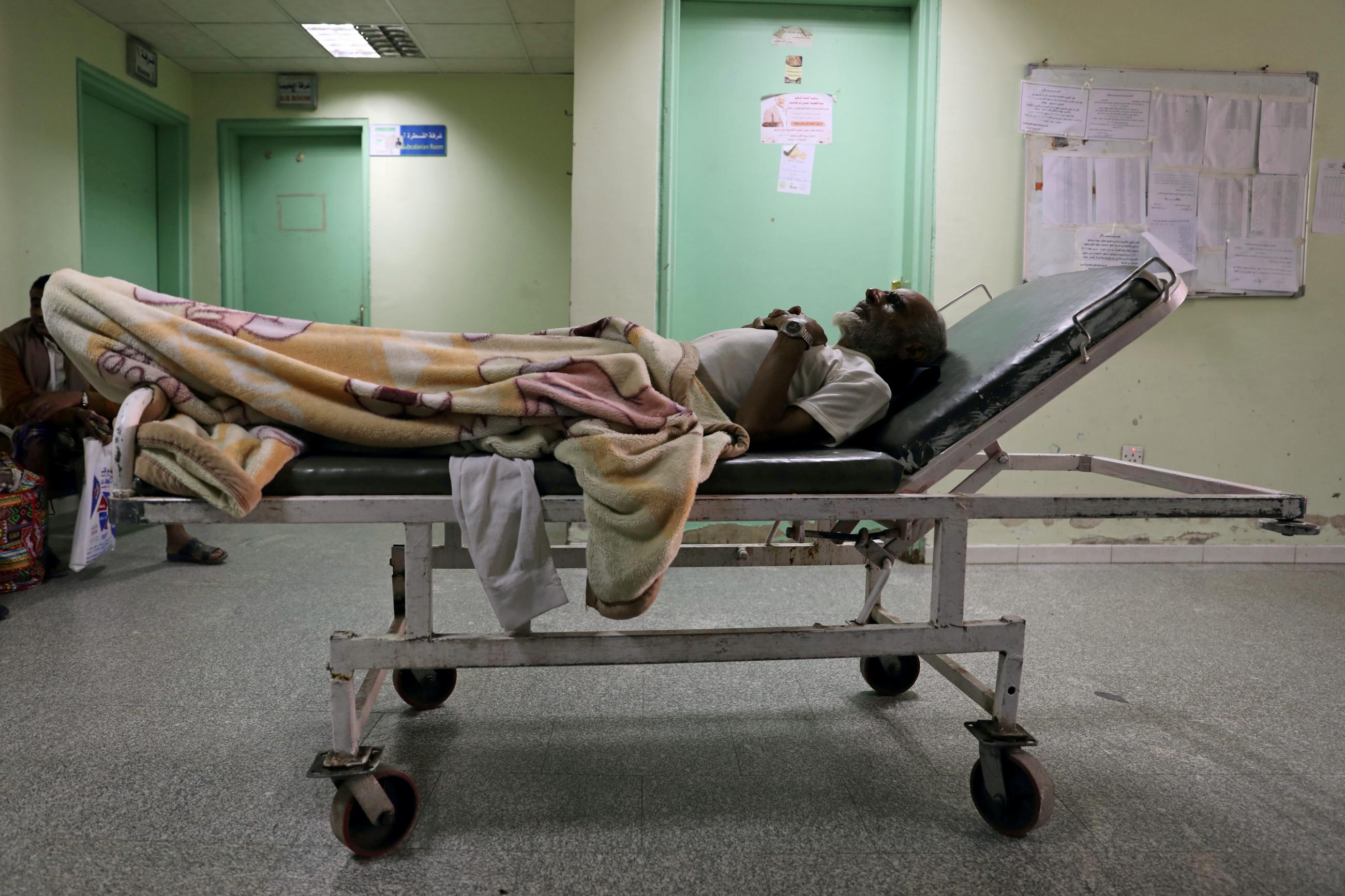 A patient lies on a bed as he waits for a dialysis session at Al-Thawra Modern General Hospital in Sanaa, Yemen, on September 13, 2020.