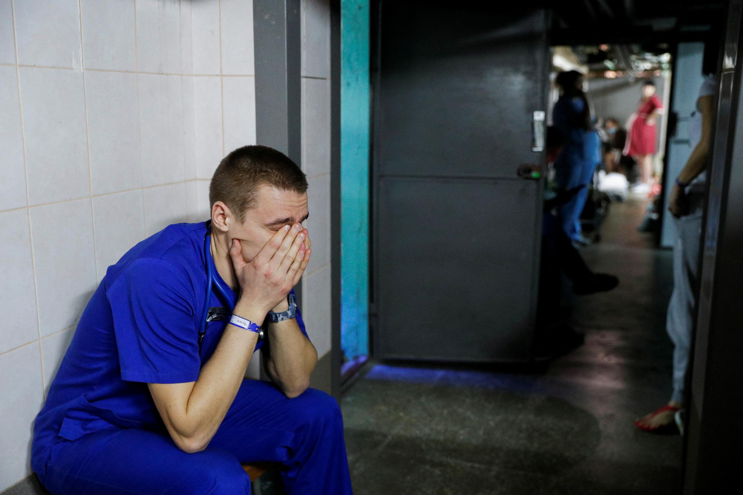 A doctor takes shelter in the basement of a perinatal center as air raid sirens sound during Russia's invasion of Ukraine, in Kyiv, Ukraine, March 2, 2022.