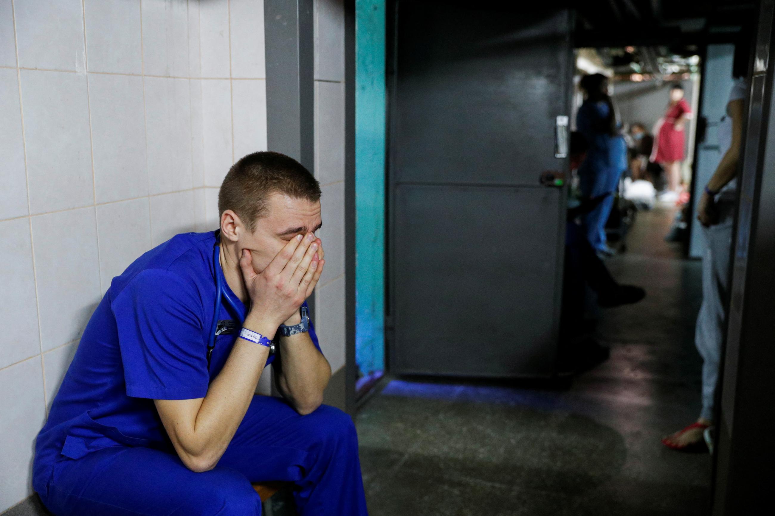 A doctor takes shelter in the basement of a perinatal center as air raid sirens sound during Russia's invasion of Ukraine, in Kyiv, Ukraine, March 2, 2022. 