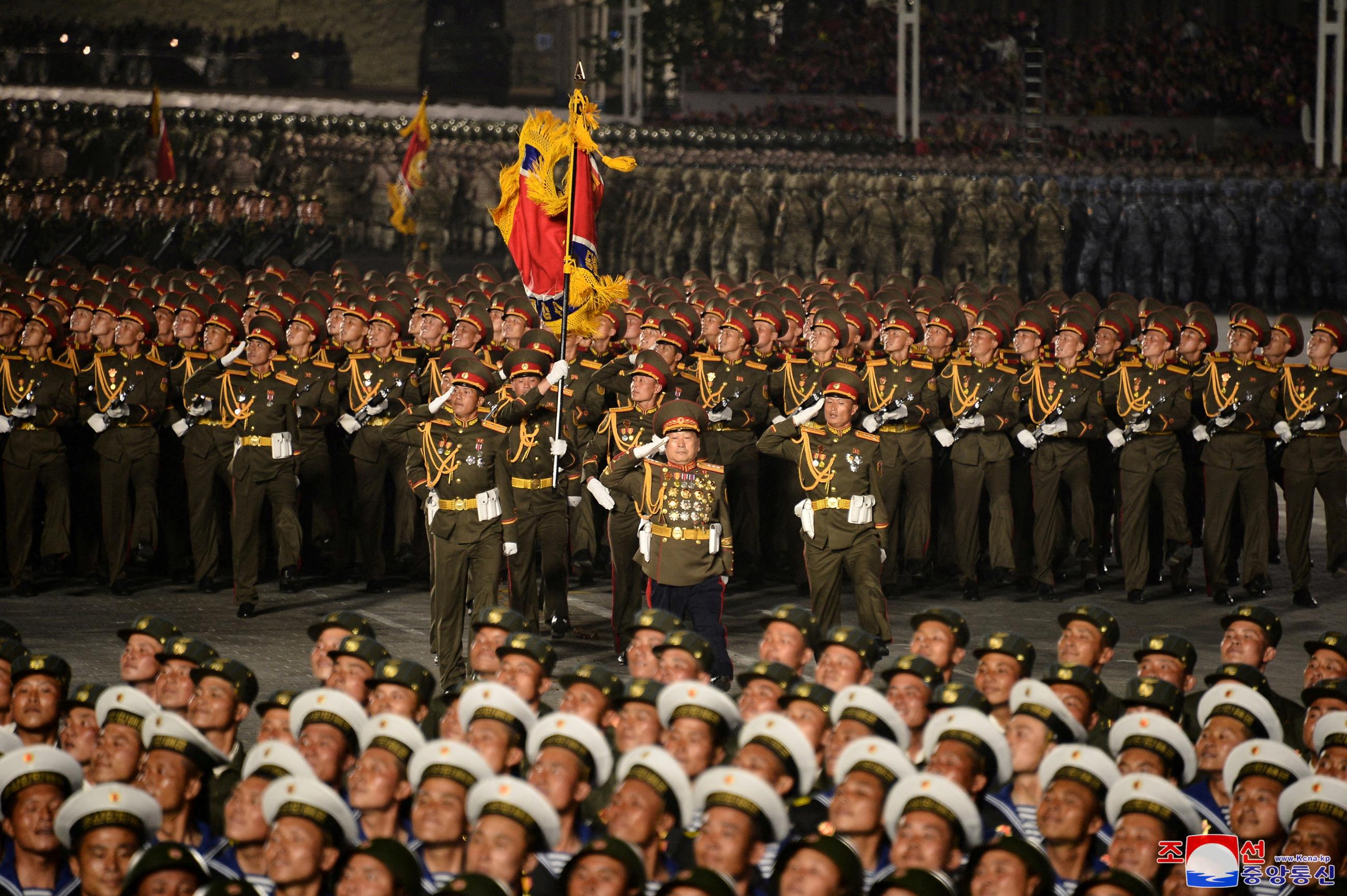 Military personnel take part in a nighttime parade to mark the 90th anniversary of the founding of the Korean People's Revolutionary Army in Pyongyang, North Korea, in this undated photo released by North Korea's Korean Central News Agency (KCNA) on April 26, 2022. 