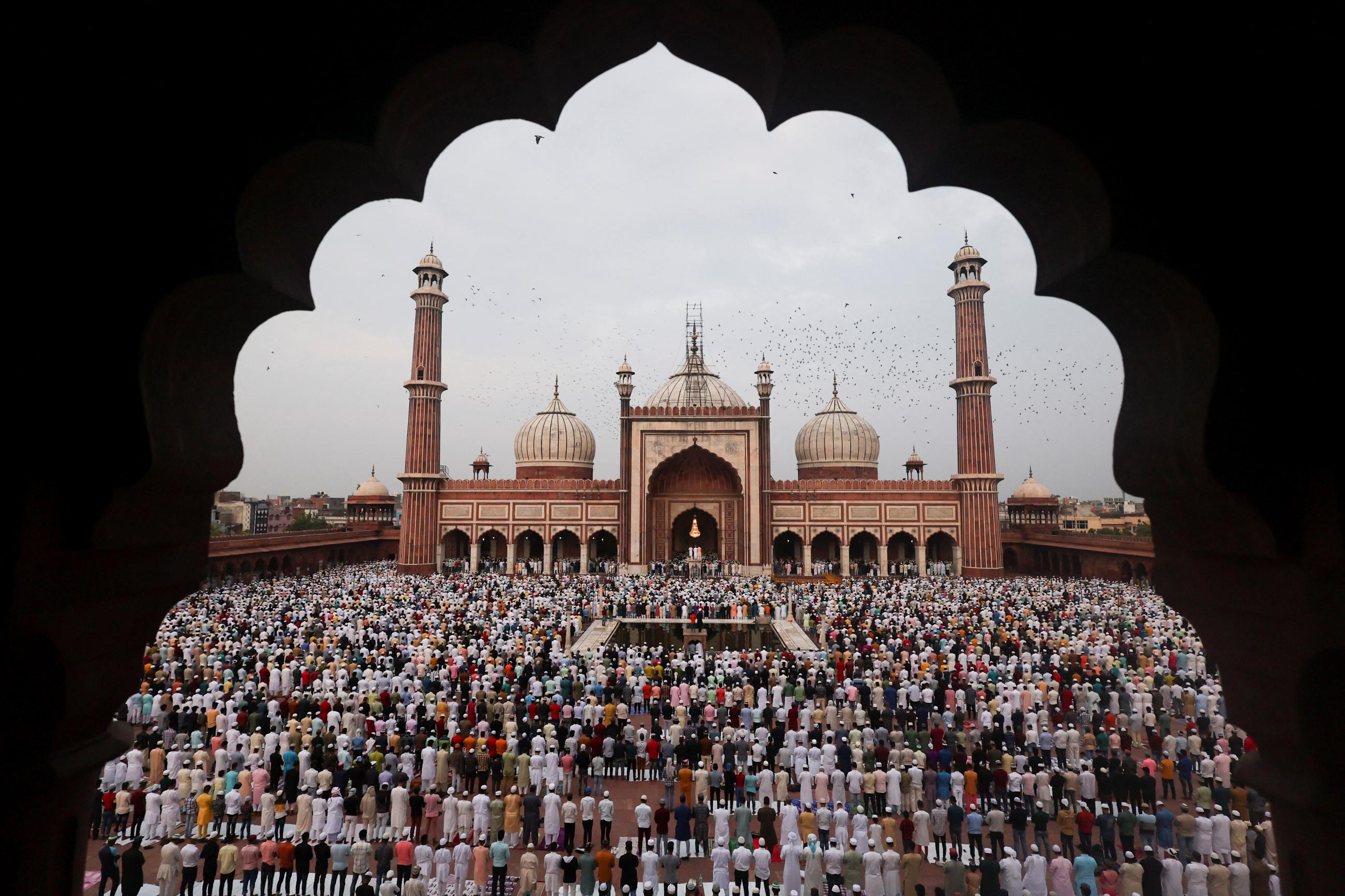 Muslims offer prayers at Jama Masjid on the occasion of Eid al-Adha festival, in the old quarters of Delhi, India, July 10, 2022. 