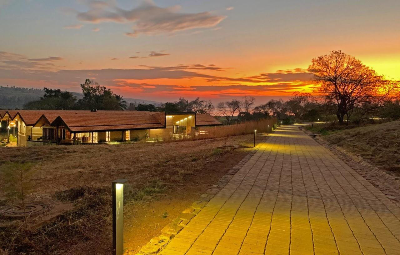 An image of the RICA campus at sunset. RICA is sustainably built and operates off-the-grid on 3,200 acres donated by the Rwandan government.