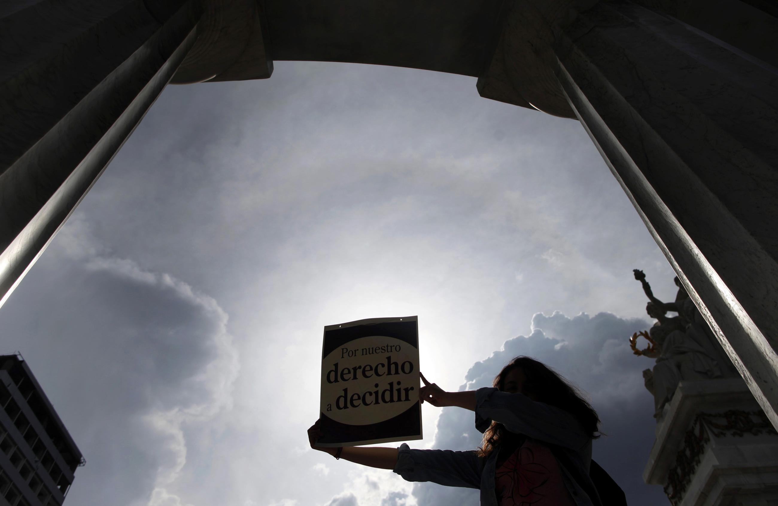 Activist holds up poster that reads, "For our right to decide", during demonstration in Mexico City.