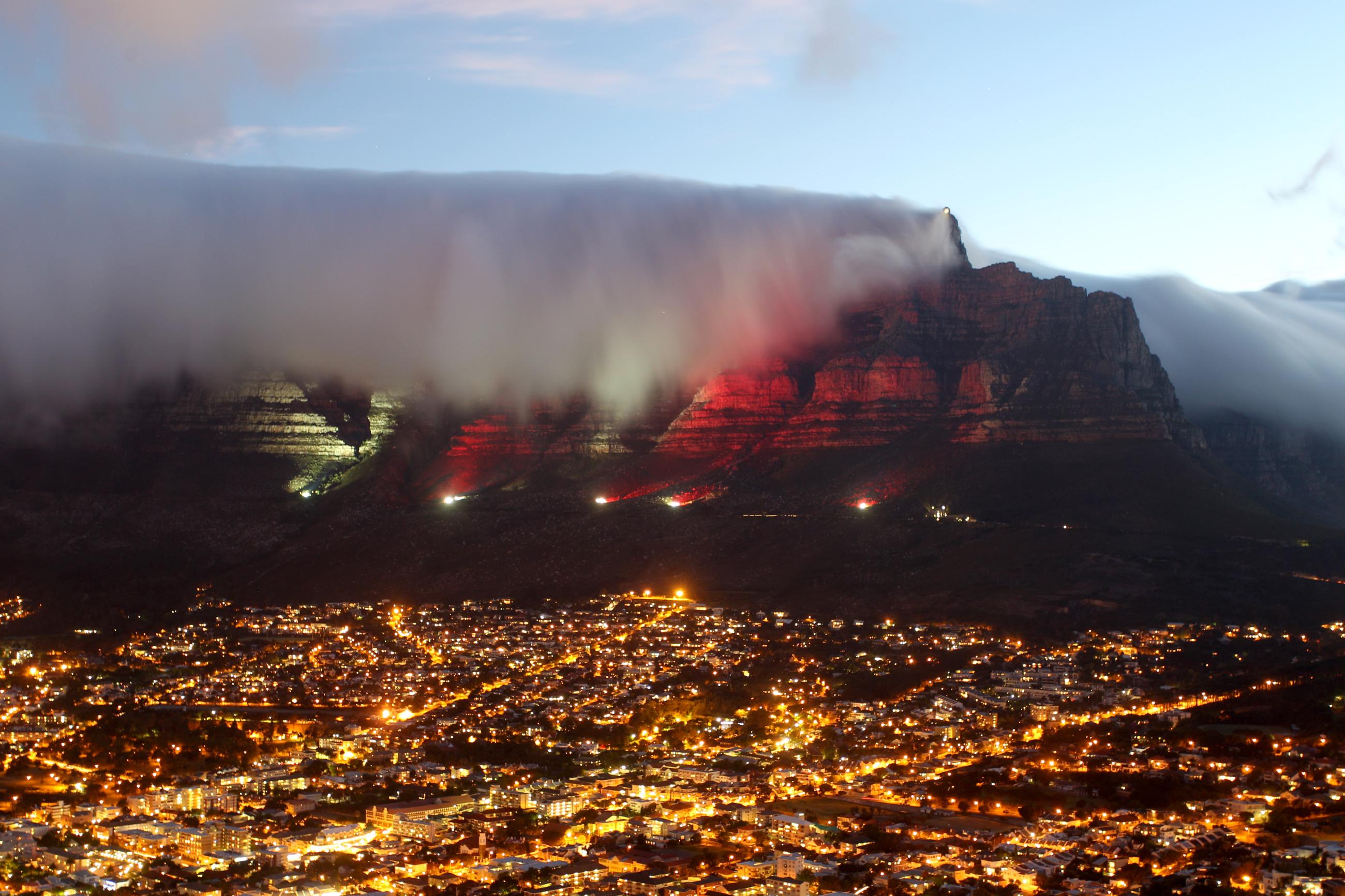 Table Mountain turns (RED) for World AIDS Day, in Cape Town, South Africa, on December 1, 2010.