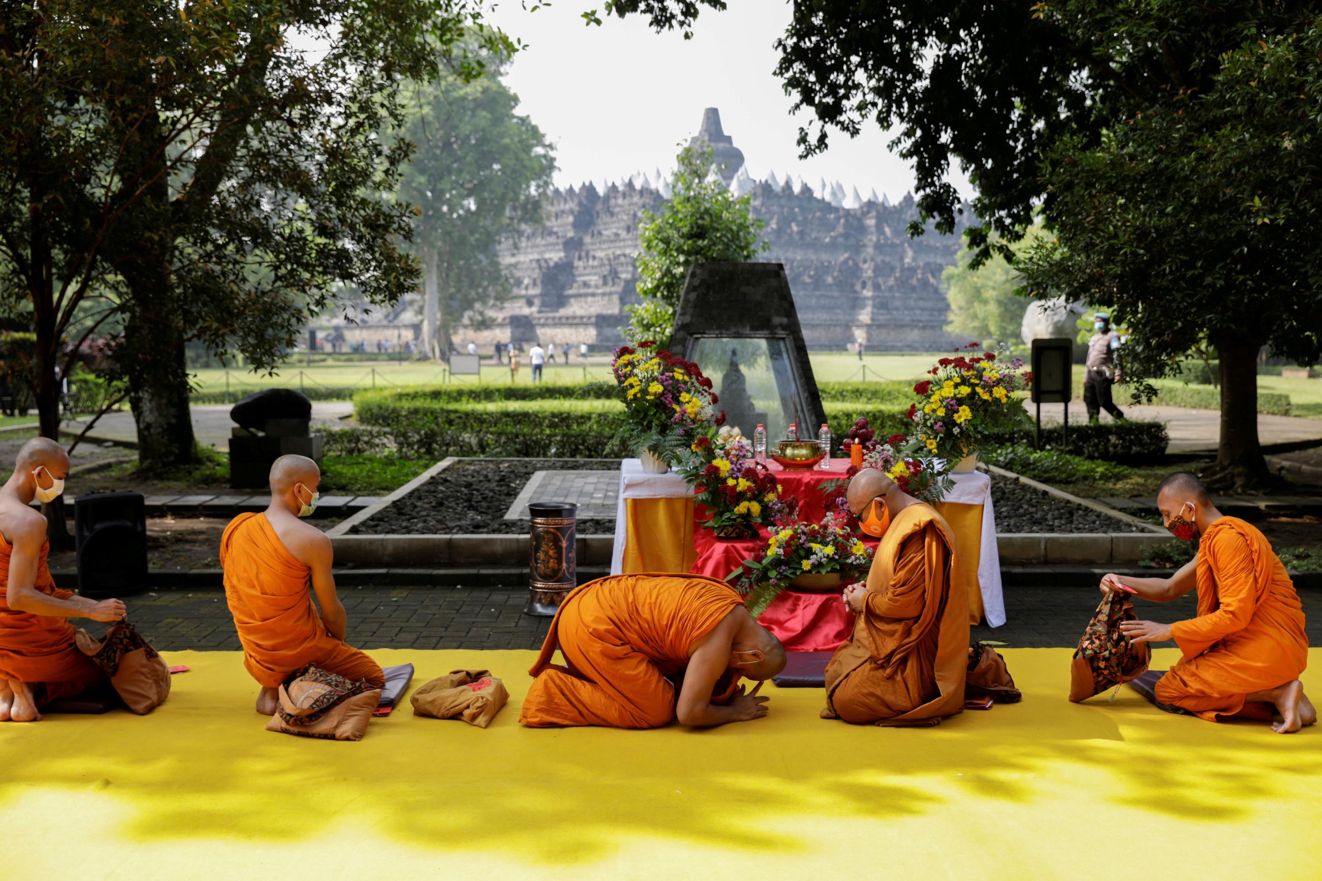 Buddhist monks wearing protective masks takes part on a ritual at the Borobudur temple, in Magelang, Central Java province, Indonesia, on May 26, 2021.