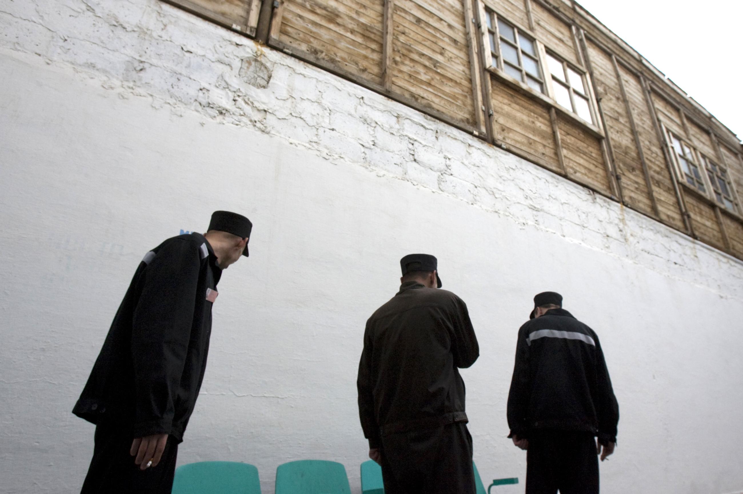 Inmates walk in the yard of a tuberculosis prison hospital in Tomsk, Siberia. At the time of the photo, about 1,000 inmates are treated at the hospital, supported by U.S. NGO Partners in Health, in Russia, on June 4, 2008. 