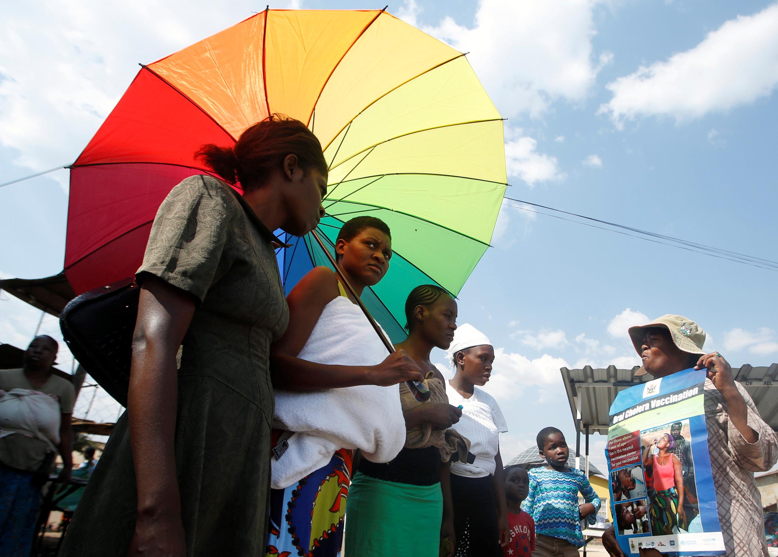 Residents queue to receive cholera vaccinations at a clinic in Harare, Zimbabwe, October 4, 2018.