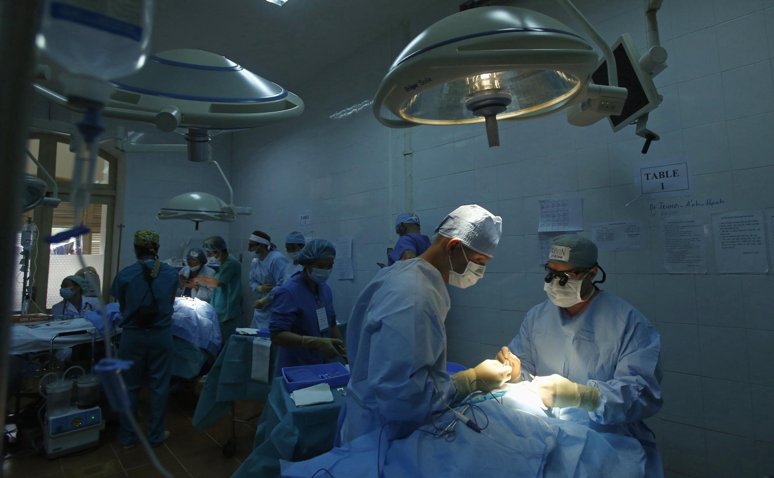 Doctors from Operation Smile perform surgeries to repair facial deformities for patients at the Vietnam Cuba hospital in Hanoi, Vietnam, on November 18, 2014.