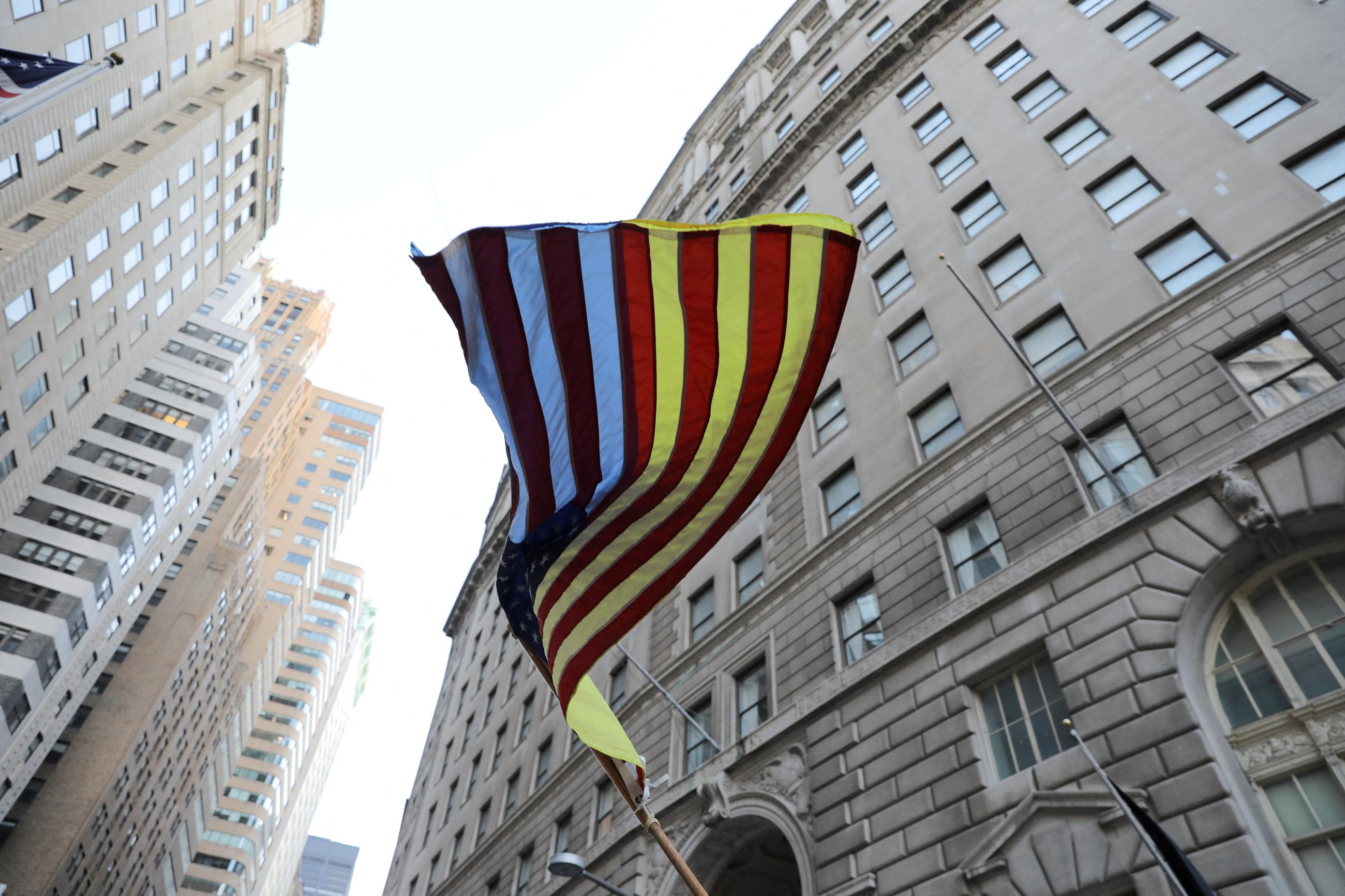 An American flag with yellow color is seen during the Ukrainian flag raising ceremony to commemorate one year since the Russian invasion of Ukraine, in New York City on February 23, 2023.