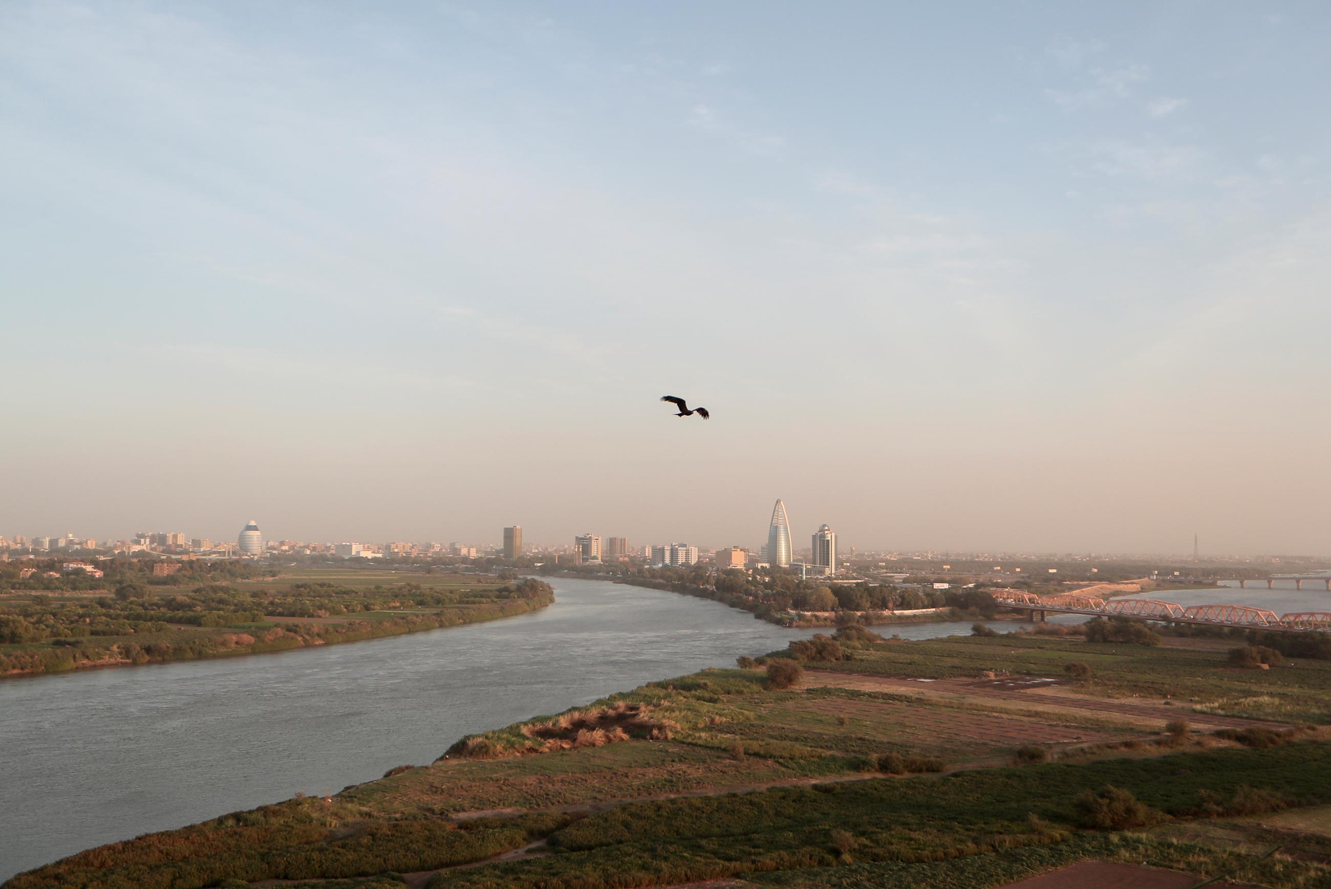 A bird flies over the convergence between the White Nile River and Blue Nile River in Khartoum, Sudan, on February 17, 2020. REUTERS/Zohra Bensemra