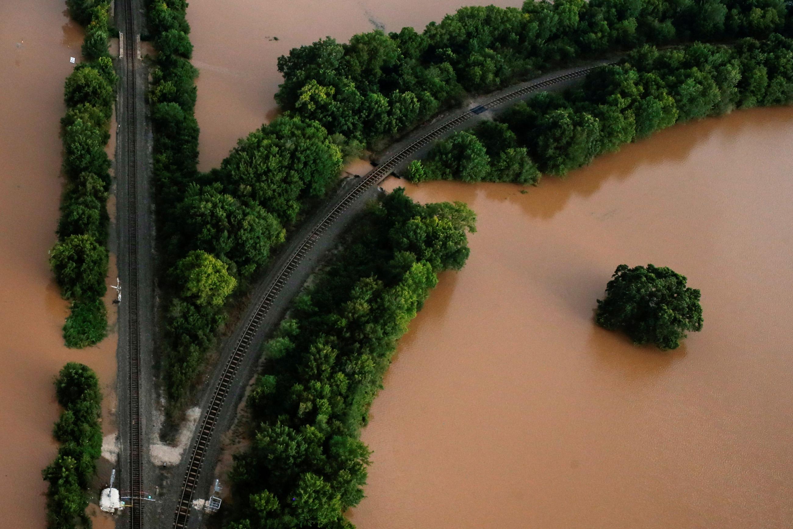 Railway lines are seen surrounded by flood waters caused by Tropical Storm Harvey near Sandy Point, Texas, on August 30, 2017.