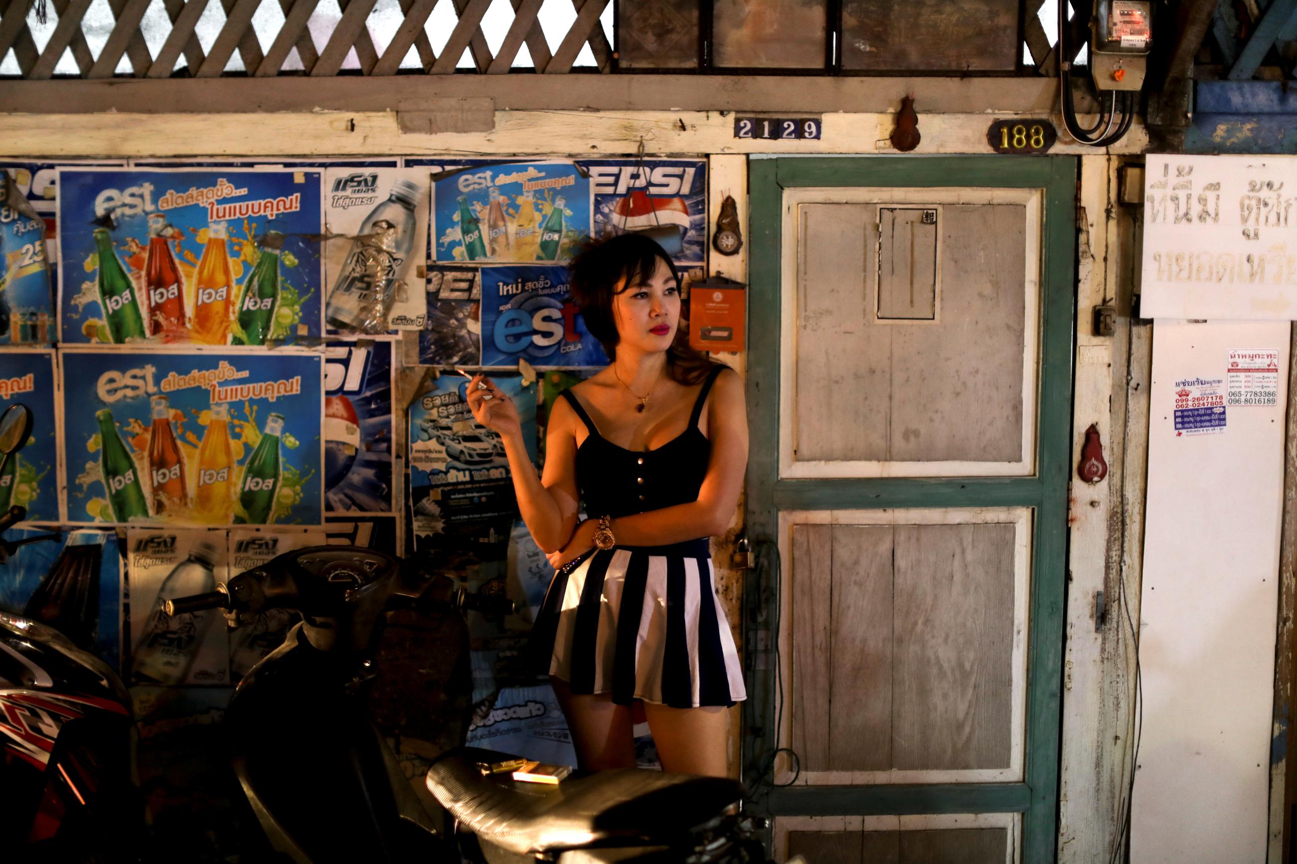 A woman smokes a cigarette in the traditional community of Kudeejeen in Bangkok, Thailand, on January 19, 2019. 