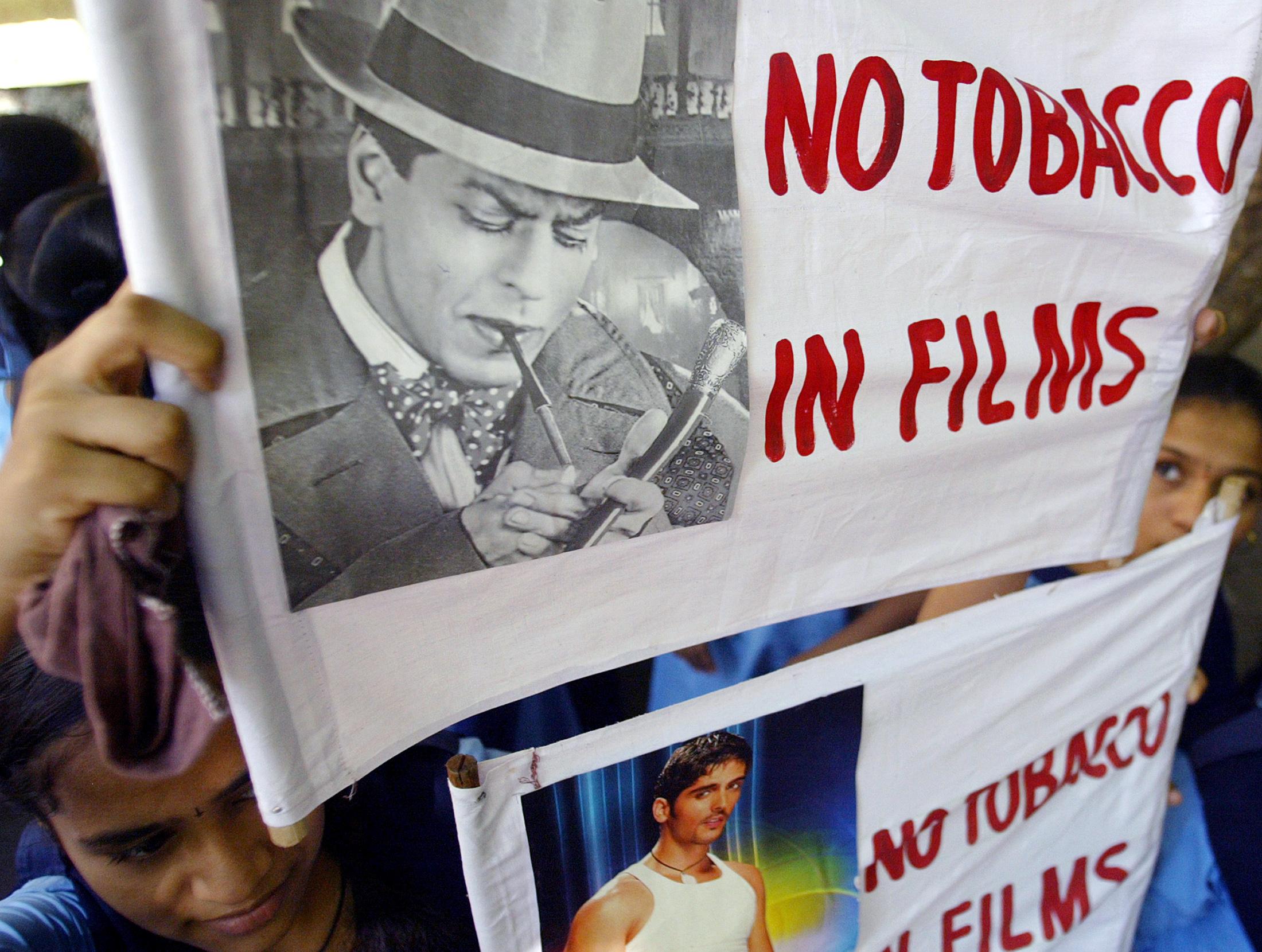 School children hold banners as they participate in a rally to support the government's decision to ban smoking in Bollywood movies, in Bombay, India, on June 17, 2005.