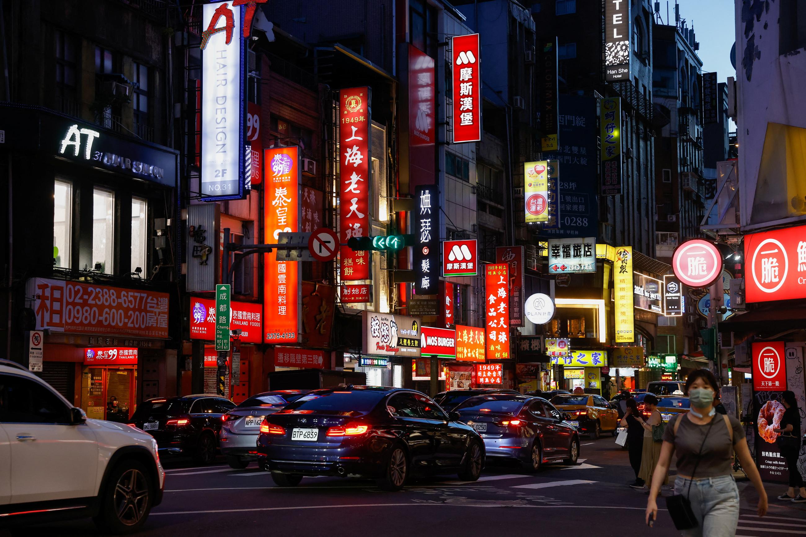 People walk on the street in Taipei, Taiwan, July 25, 2023. 