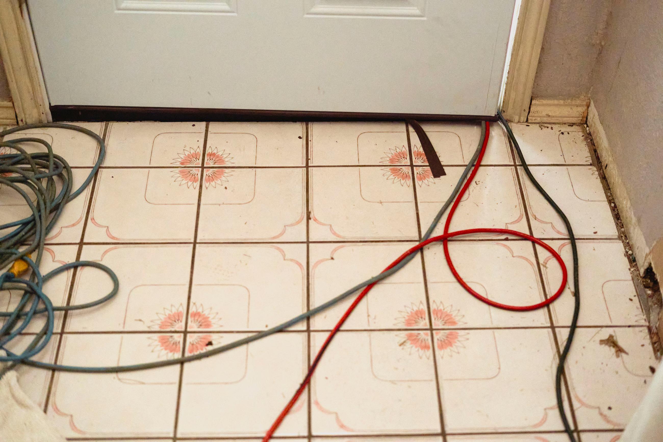 Extension cords run into a house from a portable generator on the porch after winter weather caused electricity blackouts and "boil water" notices in Fort Worth, Texas, U.S., February 20, 2021.