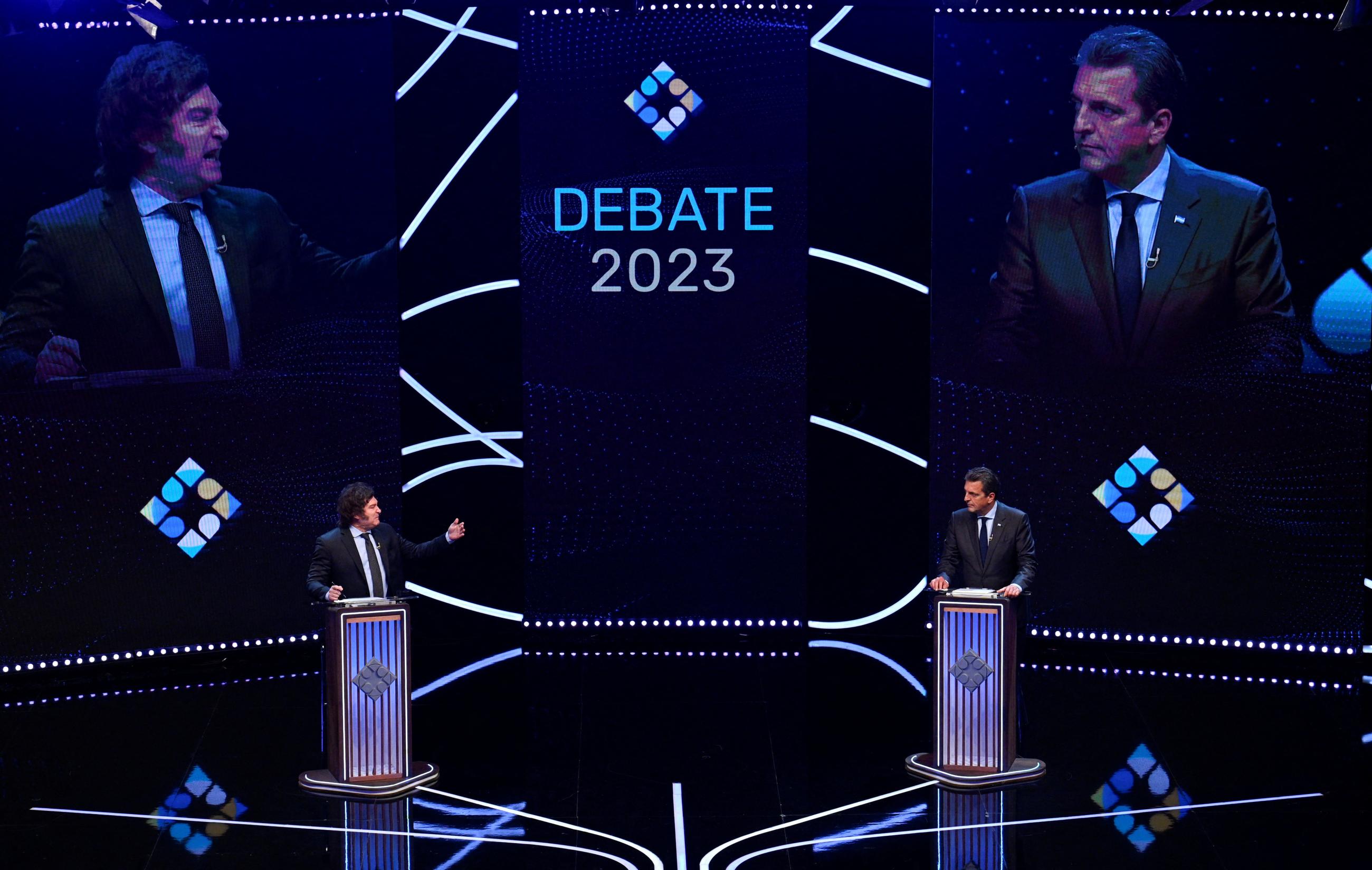 Argentina presidential candidates Sergio Massa of Union por la Patria party and Javier Milei of La Libertad Avanza party interact during the presidential debate ahead of the November 19 general election, at the University of Buenos Aires' Law School, in Buenos Aires Argentina November 12, 2023.