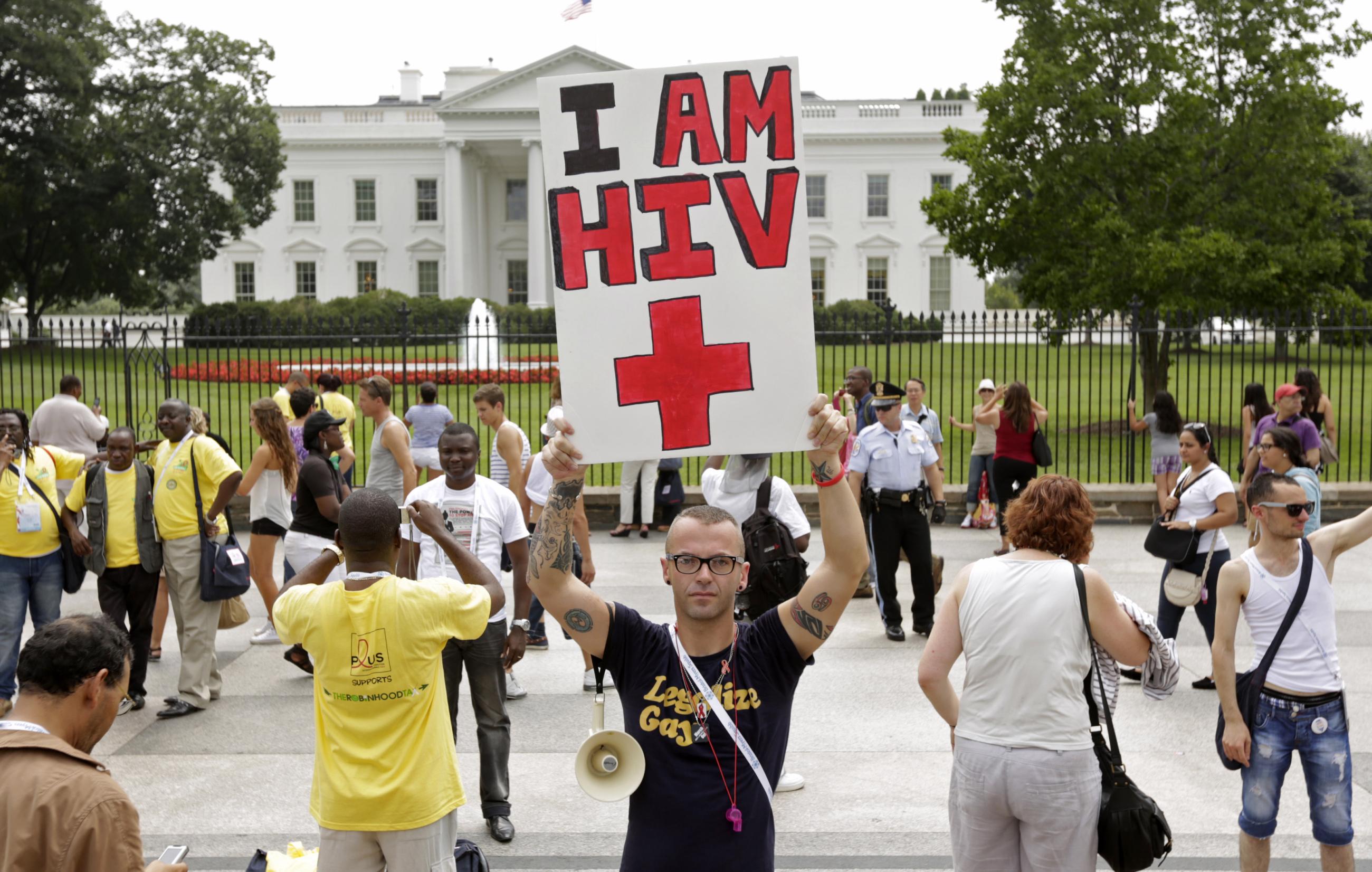 A man takes part in a demonstration in front of the White House.