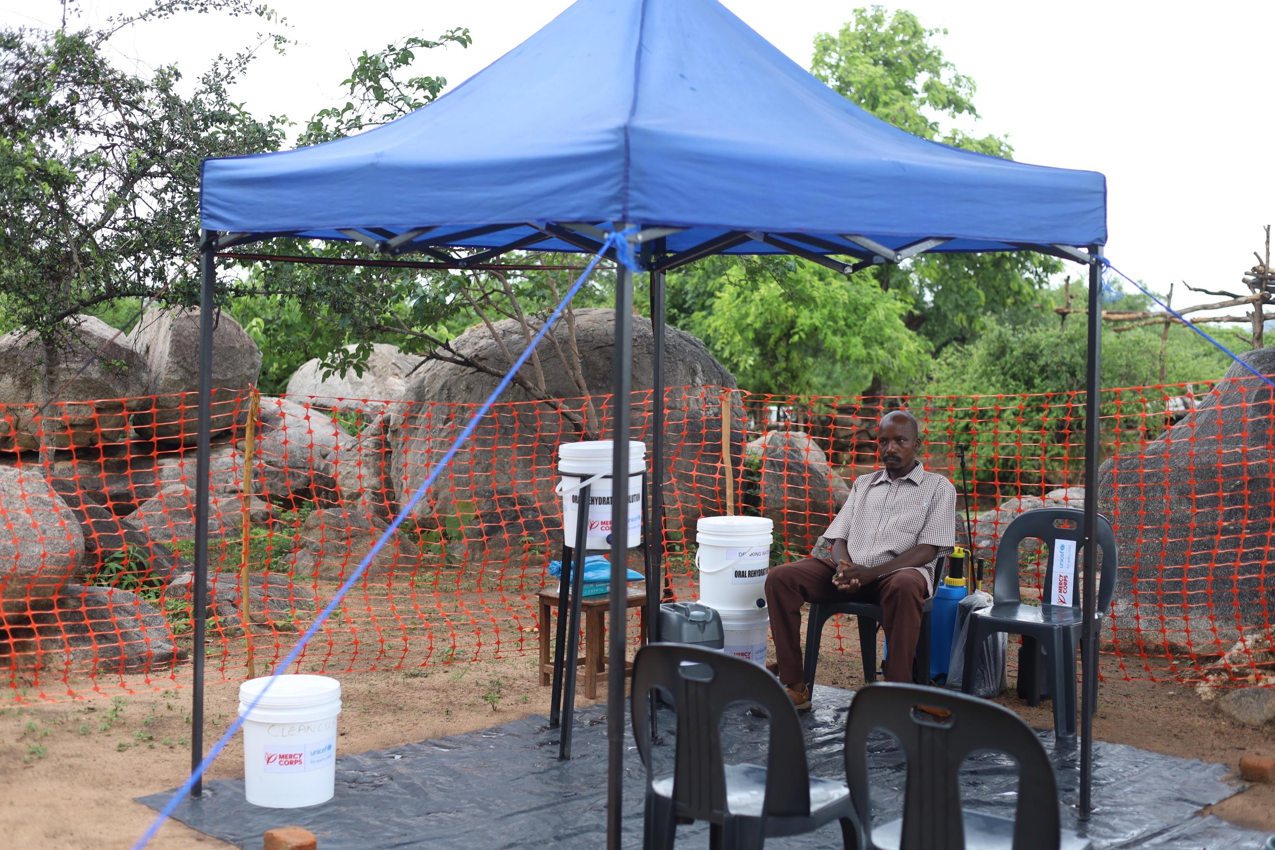 Nyasha Pukai, a village health worker, seated at one of the oral rehydration points in Marange.