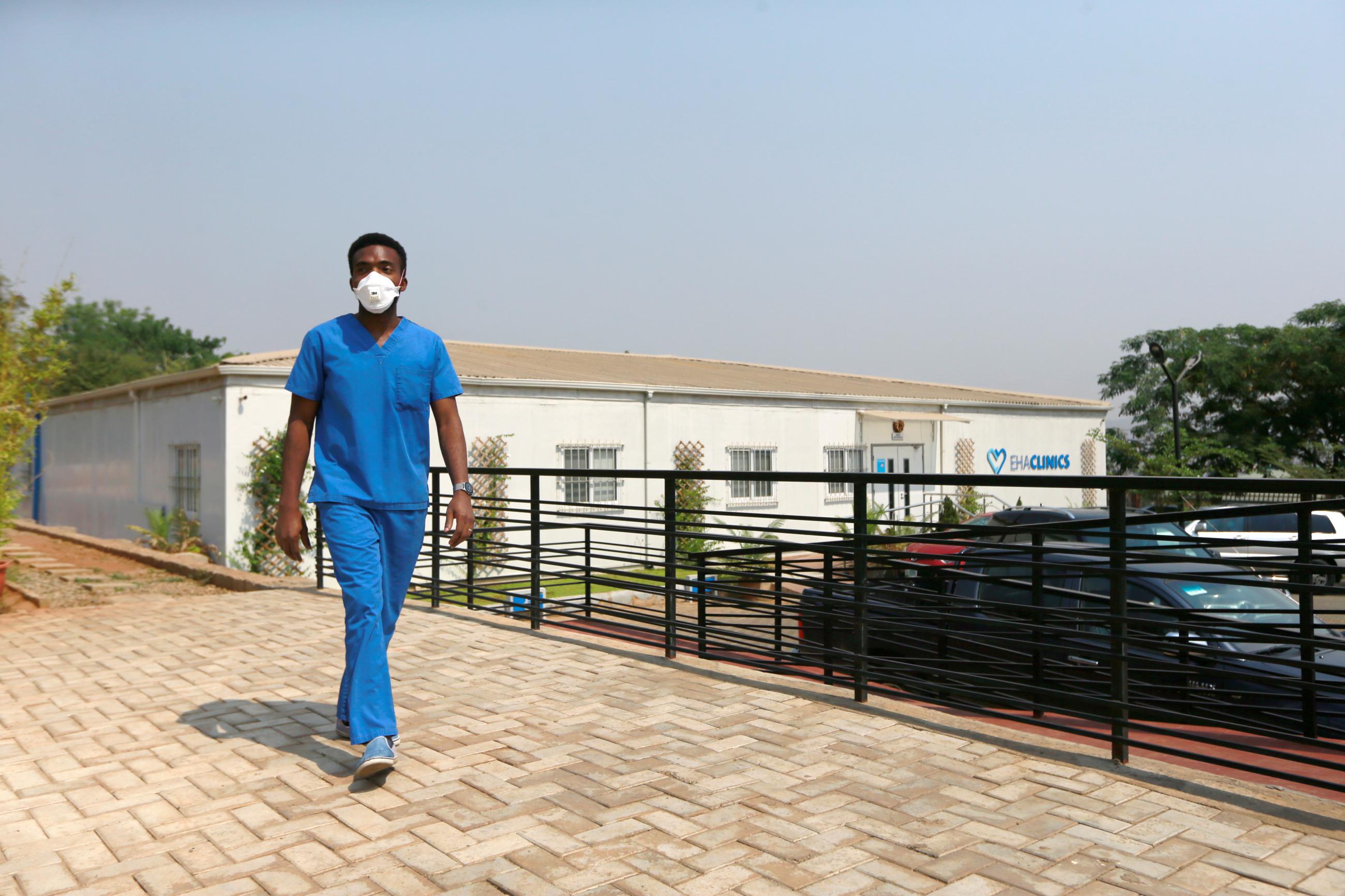 Doctor Oluwajoba Oroge walks at EHA Clinics.