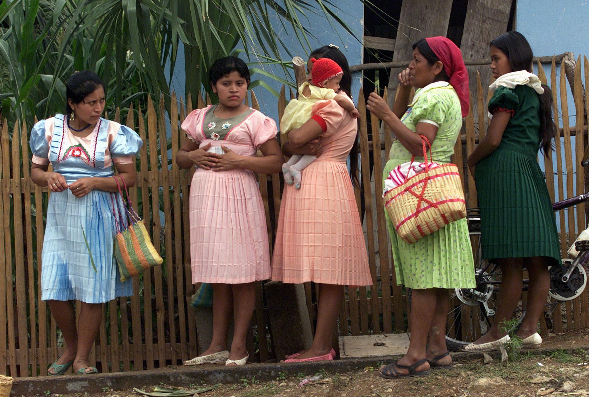 Guatemalan pregnant women line up to receive medical aid.