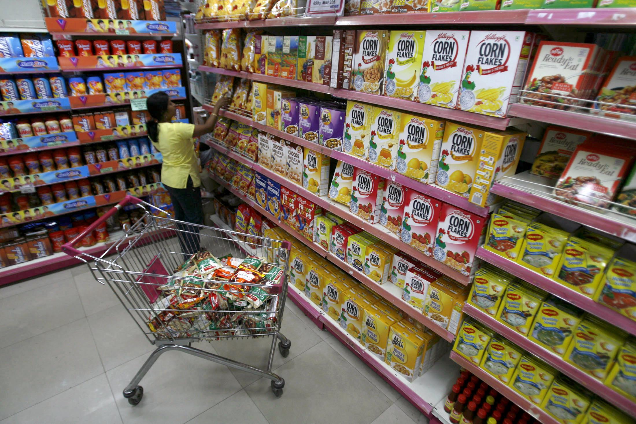 A customer collects food packets at a shopping mall.