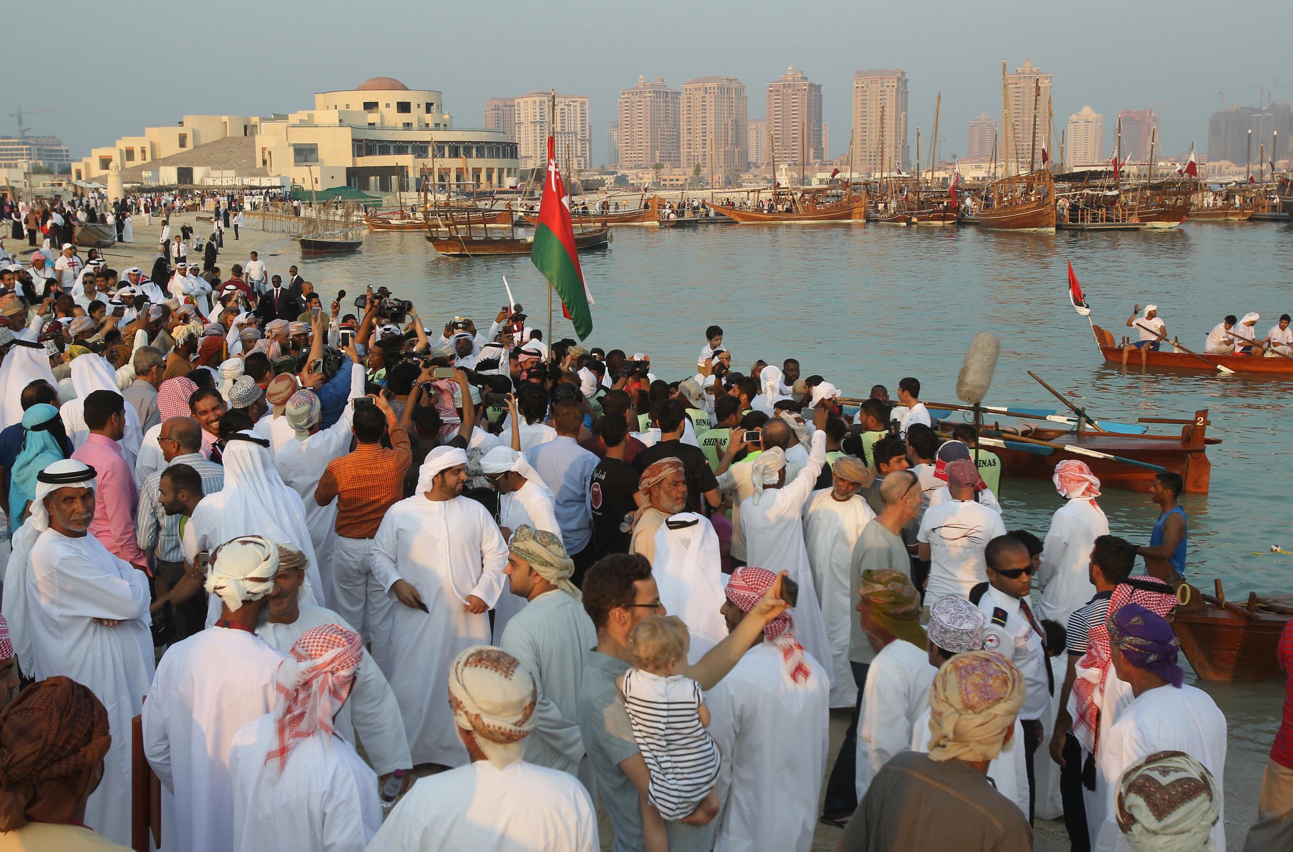 People gather on Katara beach during the 6th Traditional Dhow Festival in Doha, Qatar, November 18, 2016. 