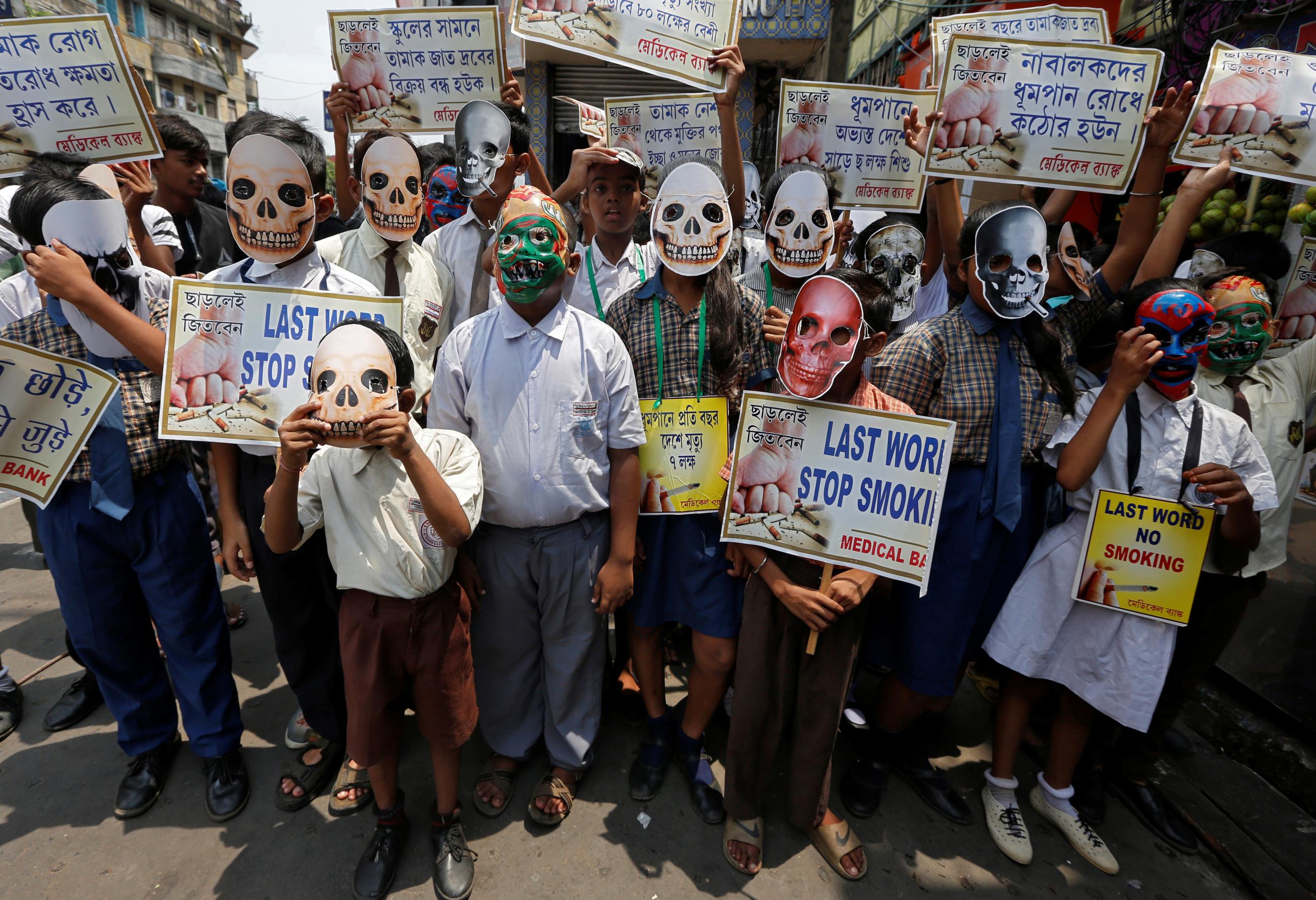 Children wearing skull masks attend an anti-tobacco awareness rally during the World No Tobacco Day.