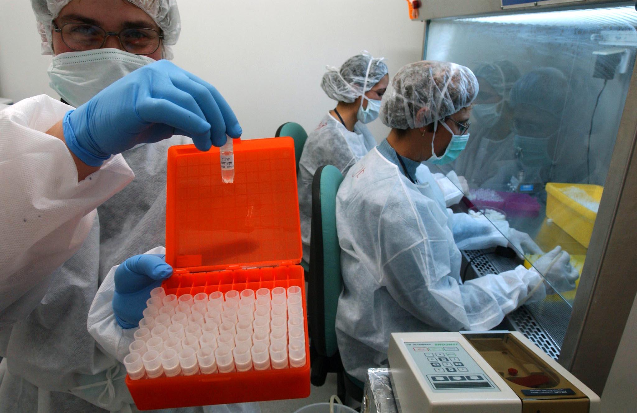 Medical personnel prepare smallpox vaccines.