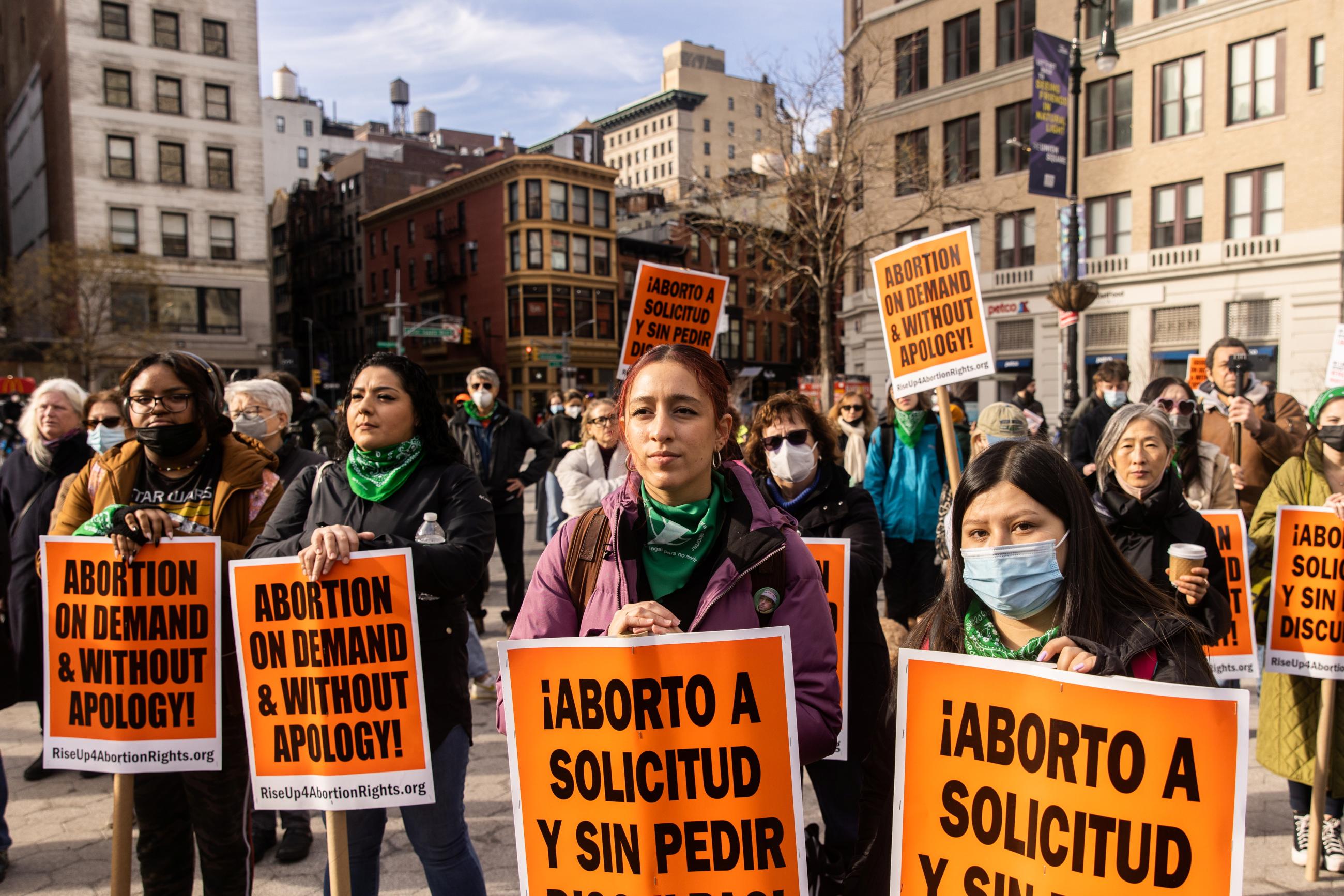 People attend an International Women's Day rally.