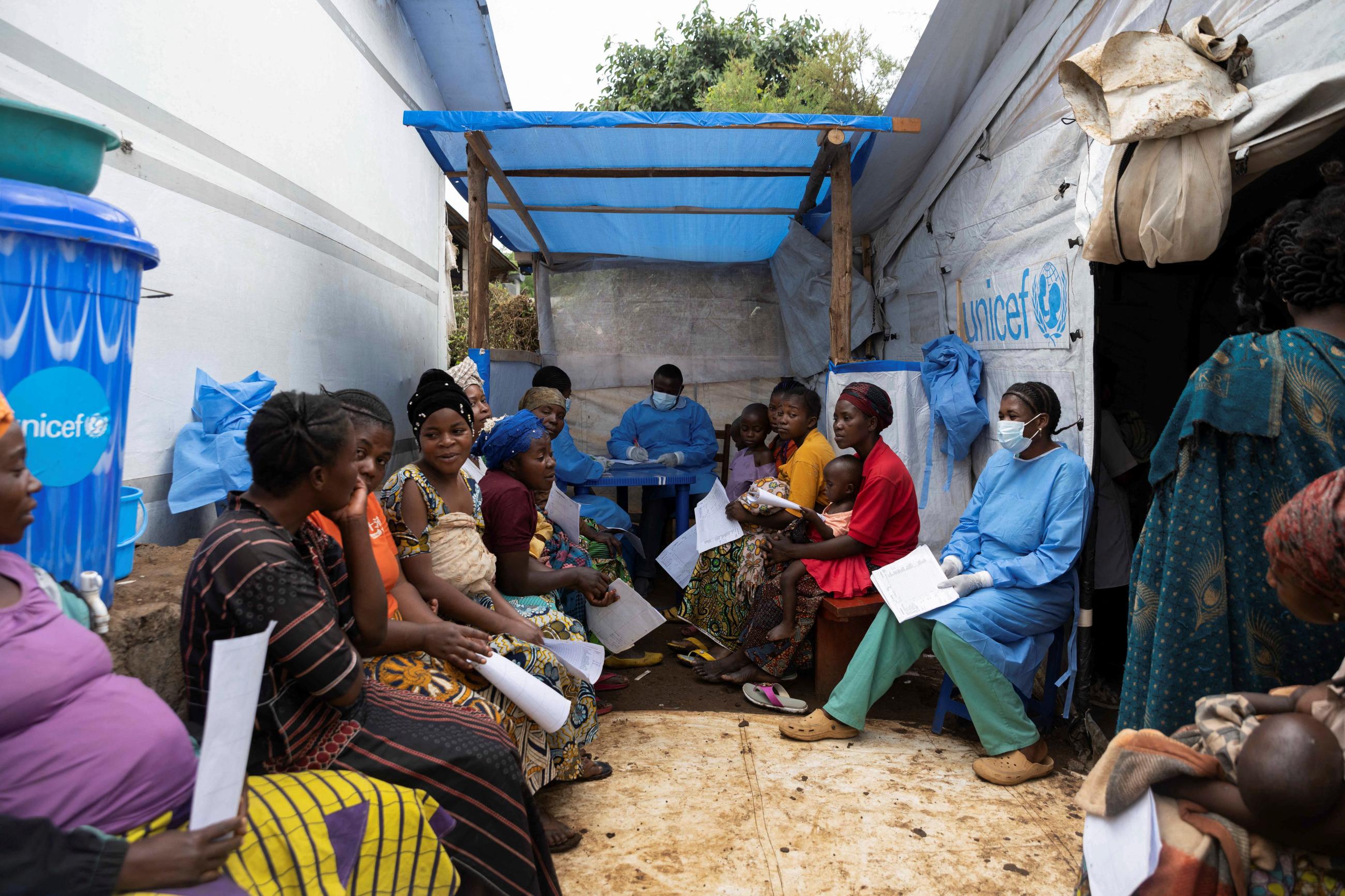 Suspected mpox patients wait for a consultation at the mpox treatment center at Kavumu hospital.