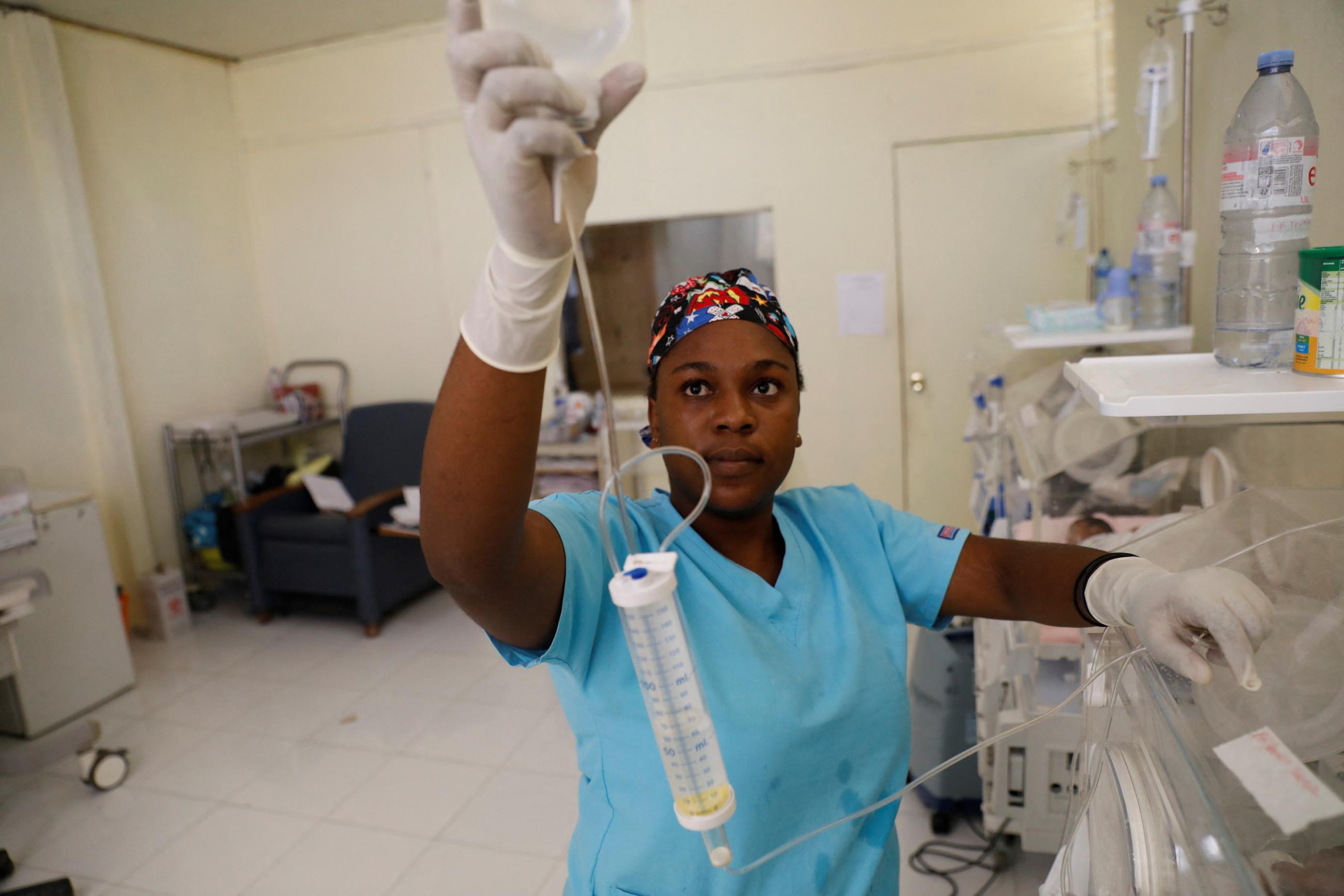 Registered Nurse Alexandre Michaelle checks the incubator equipment for a malnourished infant receiving treatment at the Centre Hospitalier de Fontaine, in Port-au-Prince, Haiti on July 26, 2023. 
