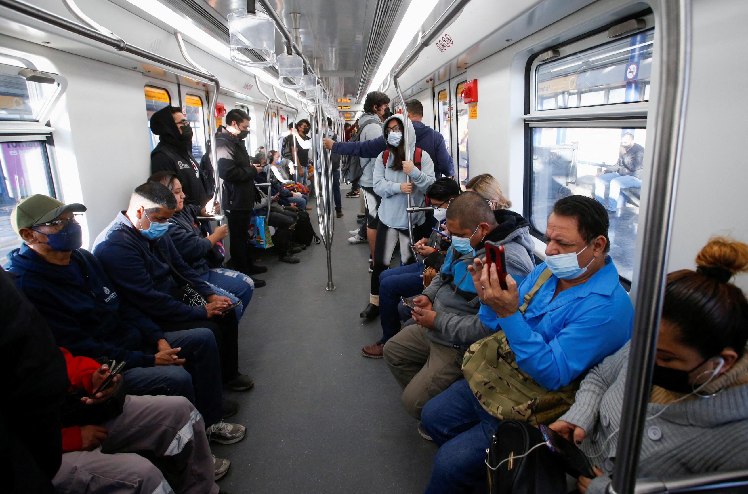 Passengers wear masks while riding the metro, in Monterrey, Mexico, on December 16, 2022. 