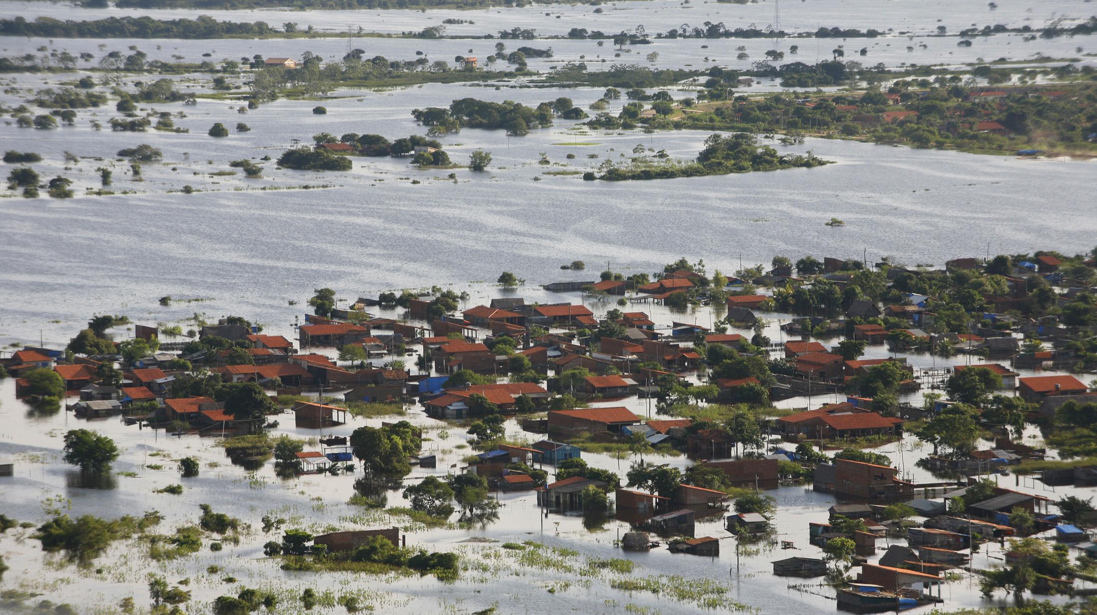 An aerial view is seen of a part of flooded Trinidad, some 500 km (310 miles) northeast of La Paz, February 12, 2008. Floodwater topped a highway protecting the Bolivian city of Trinidad on Tuesday, threatening to inundate 95,000 residents already suffering from severe flooding in the Amazon region