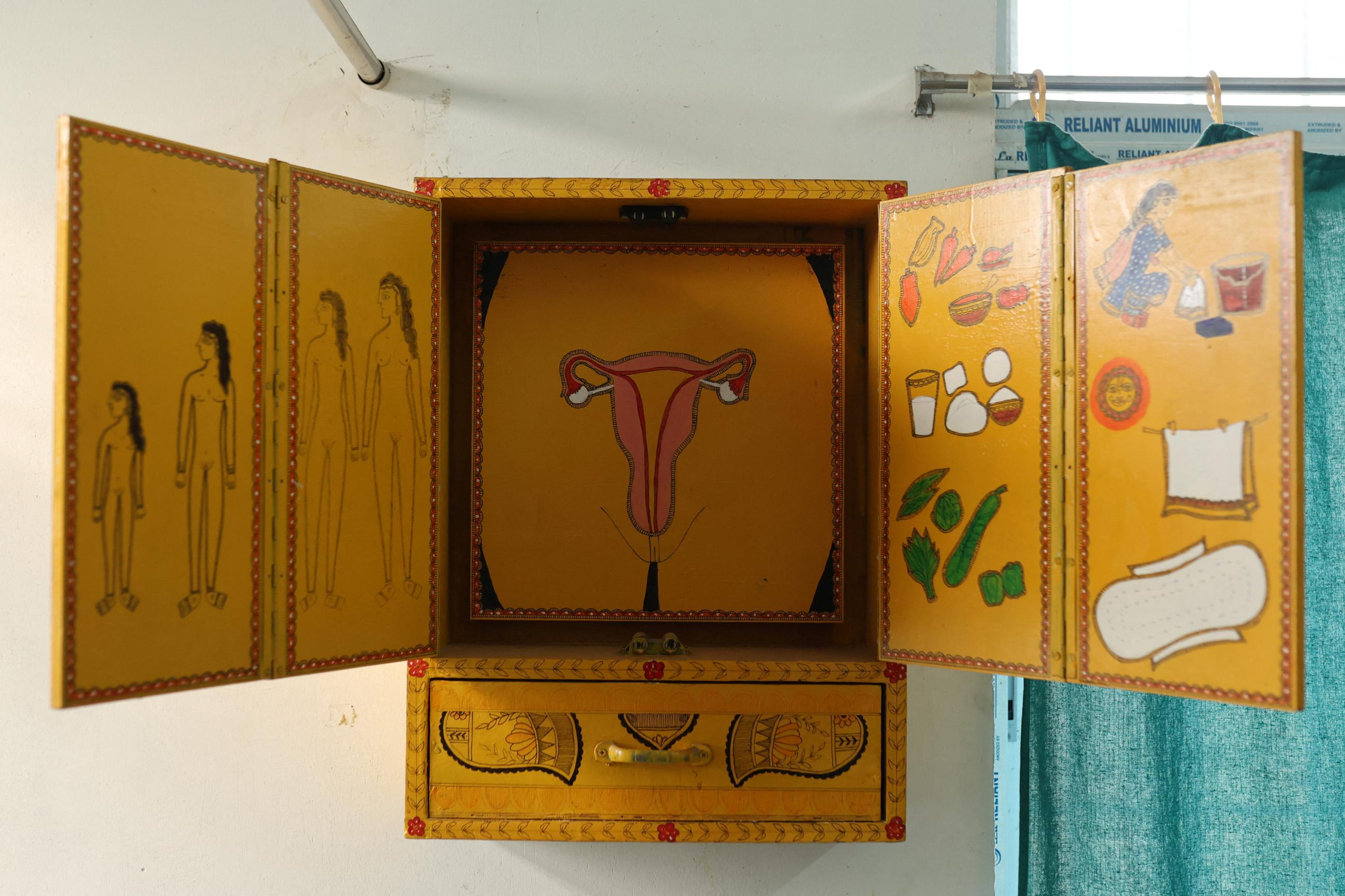 A wooden board used to explain menstruation and the female anatomy is seen inside the counseling office of a community health centre in Bahadurganj subdivision of Kishanganj district, Bihar, India, March 21, 2023.