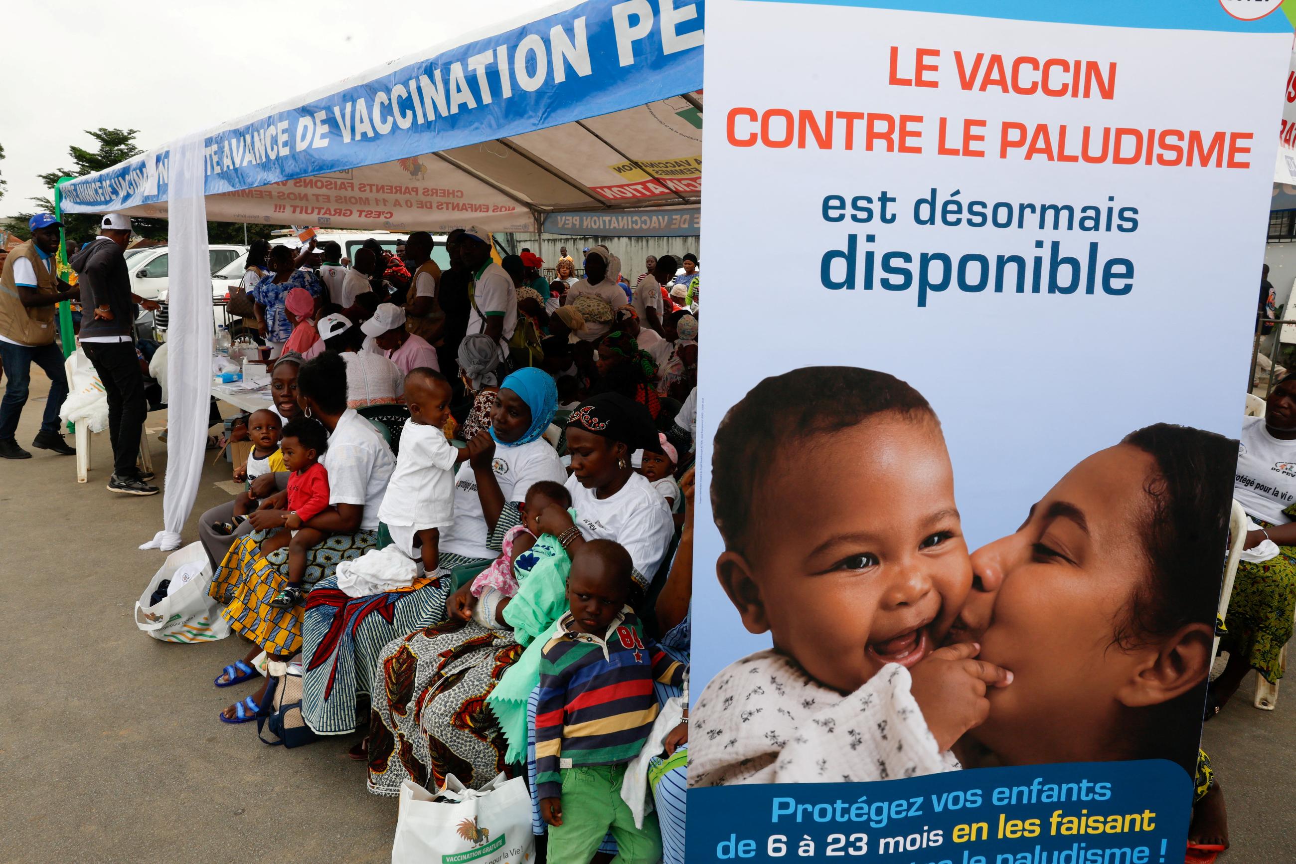 Women sit as they wait to have their children vaccinated during the official ceremony for the launch of the malaria vaccination campaign for children aged between zero and eleven months in Abobo a district of Abidjan, Ivory Coast, July 15, 2024. 