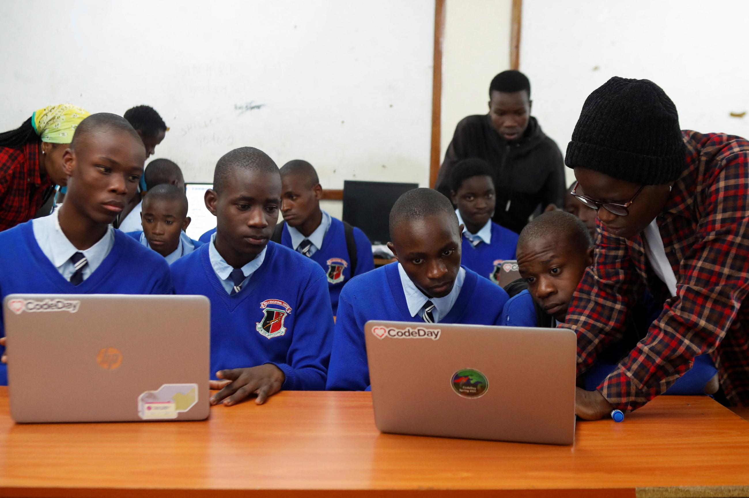 Renice Owino, founder of Code with Kids, instructs students on a laptop during a coding lesson, at the Raila Educational Centre, in Nairobi, Kenya, on May 31, 2023.