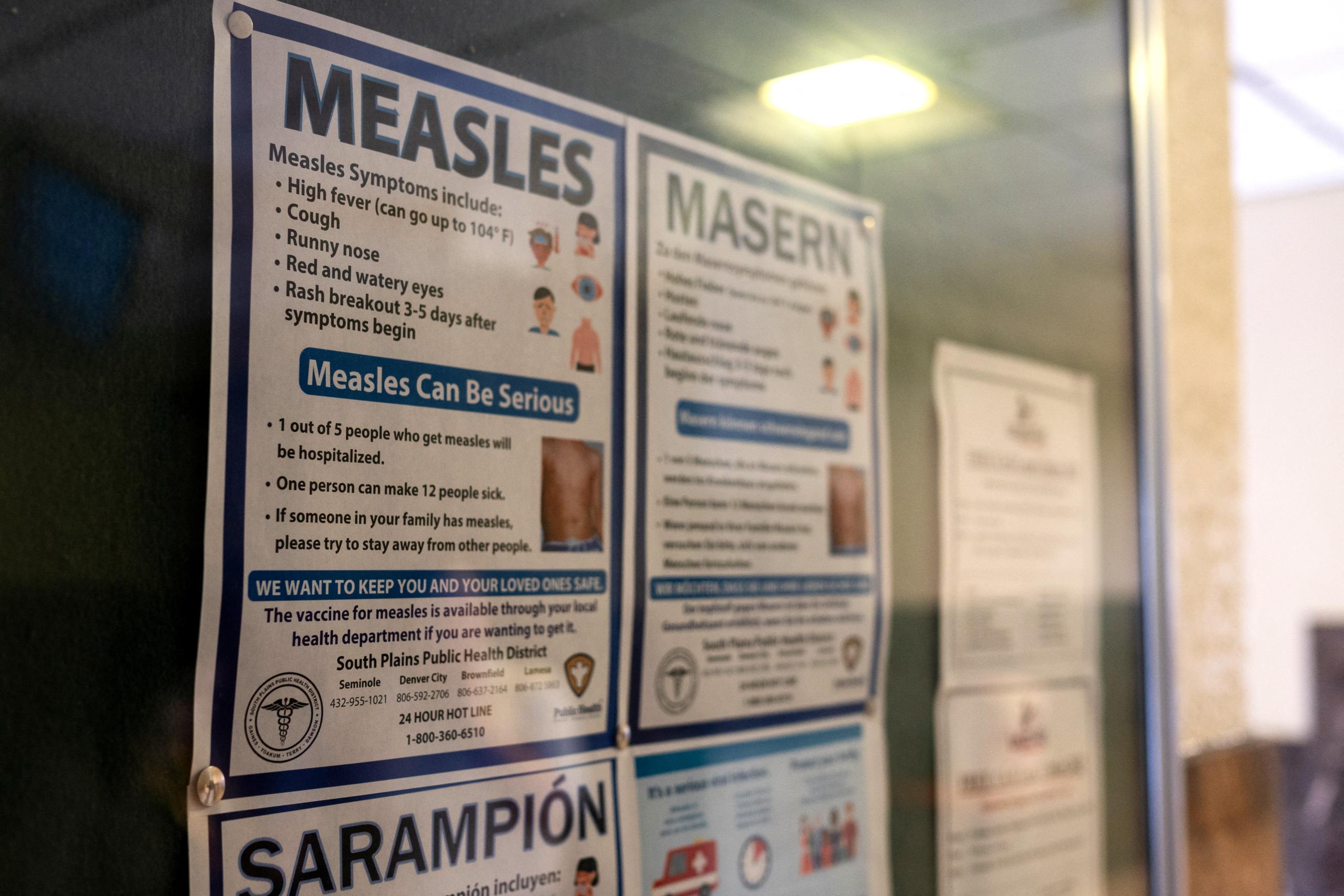 Signs inform people of measles prevention and testing, at the Gaines County Court House, in Seminole, Texas, on April 6, 2025.