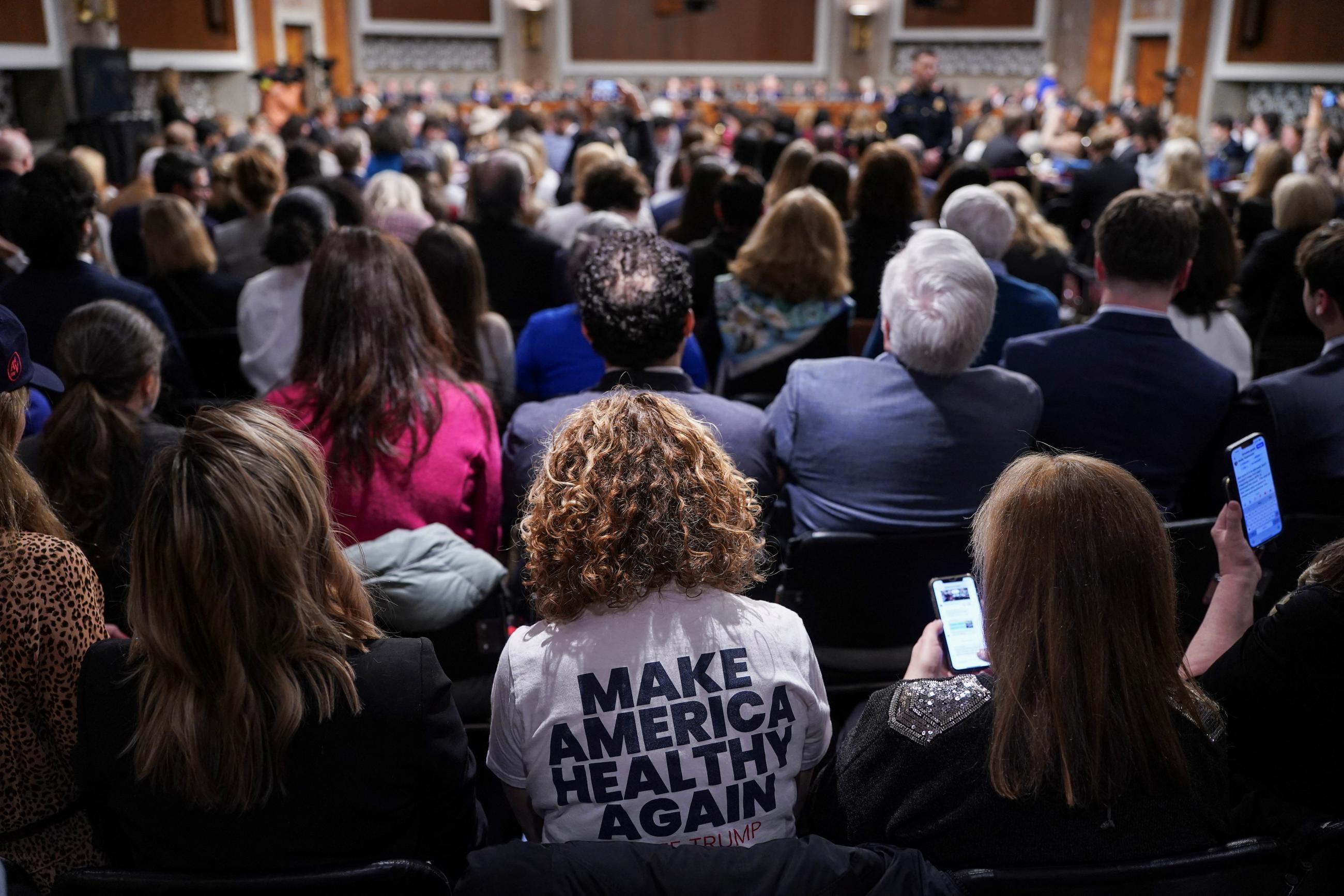 A person wears a 'Make America Healthy Again" t-shirt, as they attend a Senate Finance Committee confirmation hearing of Robert F. Kennedy Jr., on Capitol Hill, in Washington, DC, on January 29, 2025.