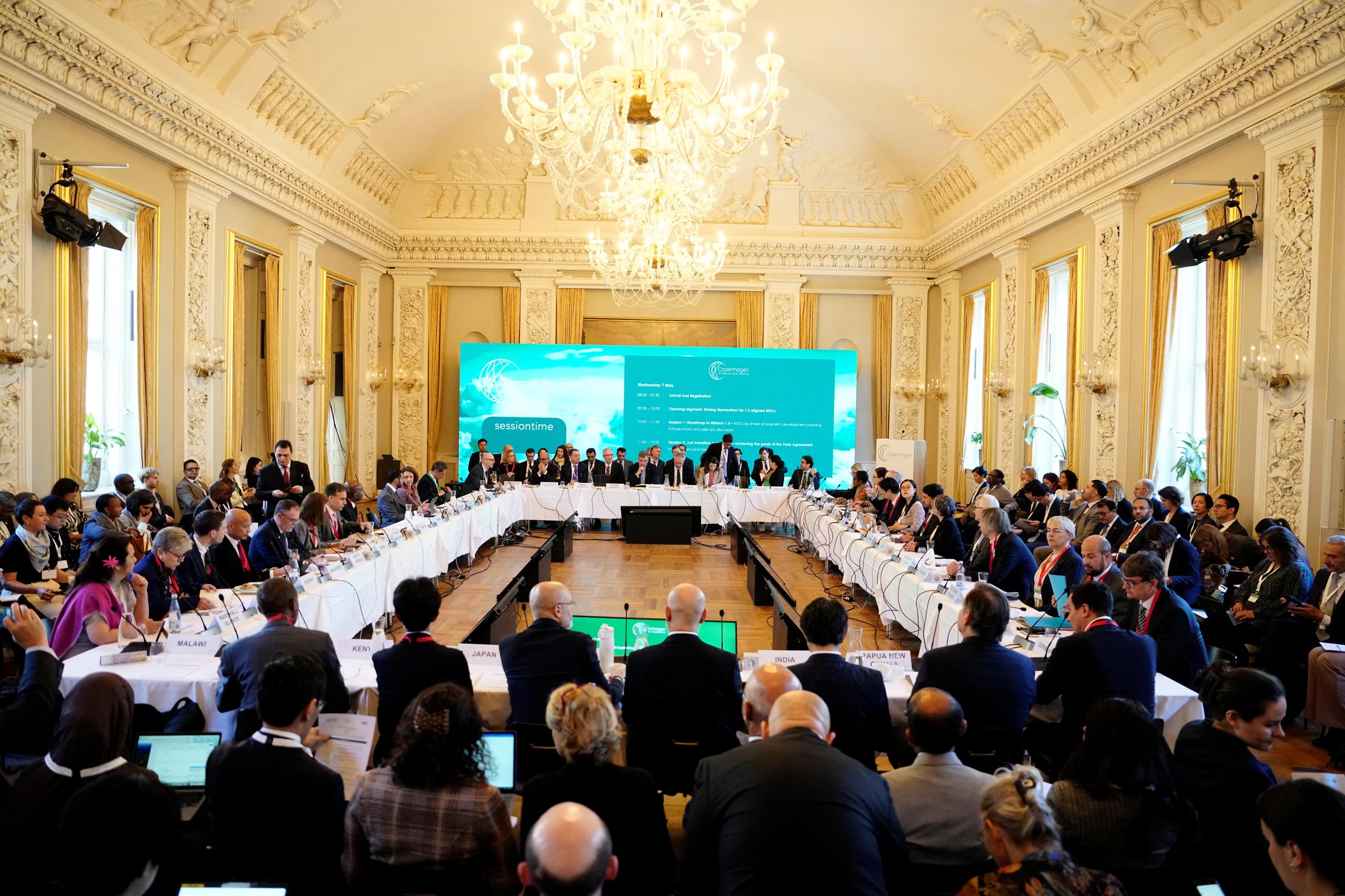 Delegates attend the Copenhagen Climate Ministerial meeting, in Copenhagen, Denmark, on May 7, 2025.