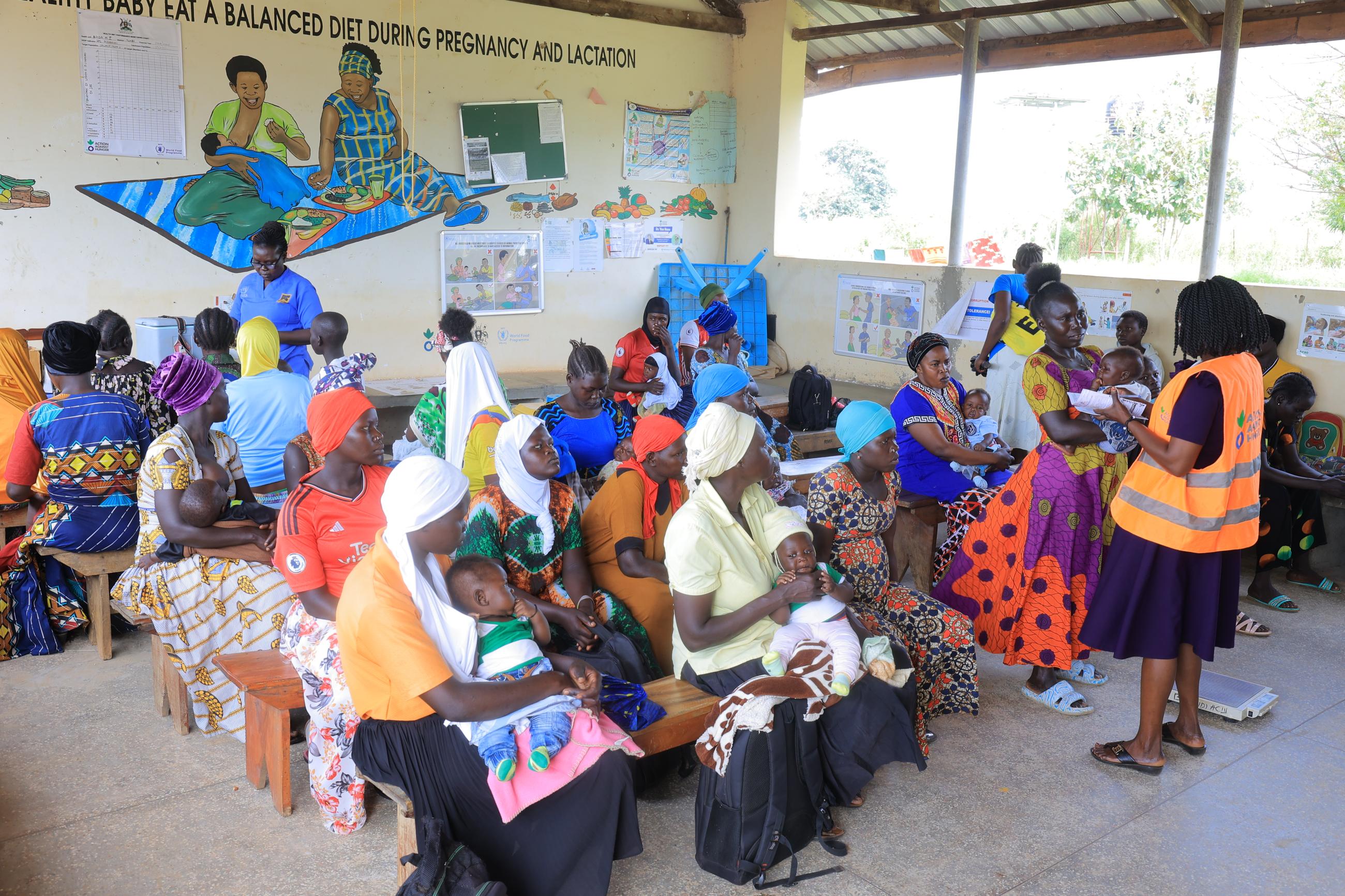 In Bidibidi Health Center, mothers wait to receive immunizations for their young children. 